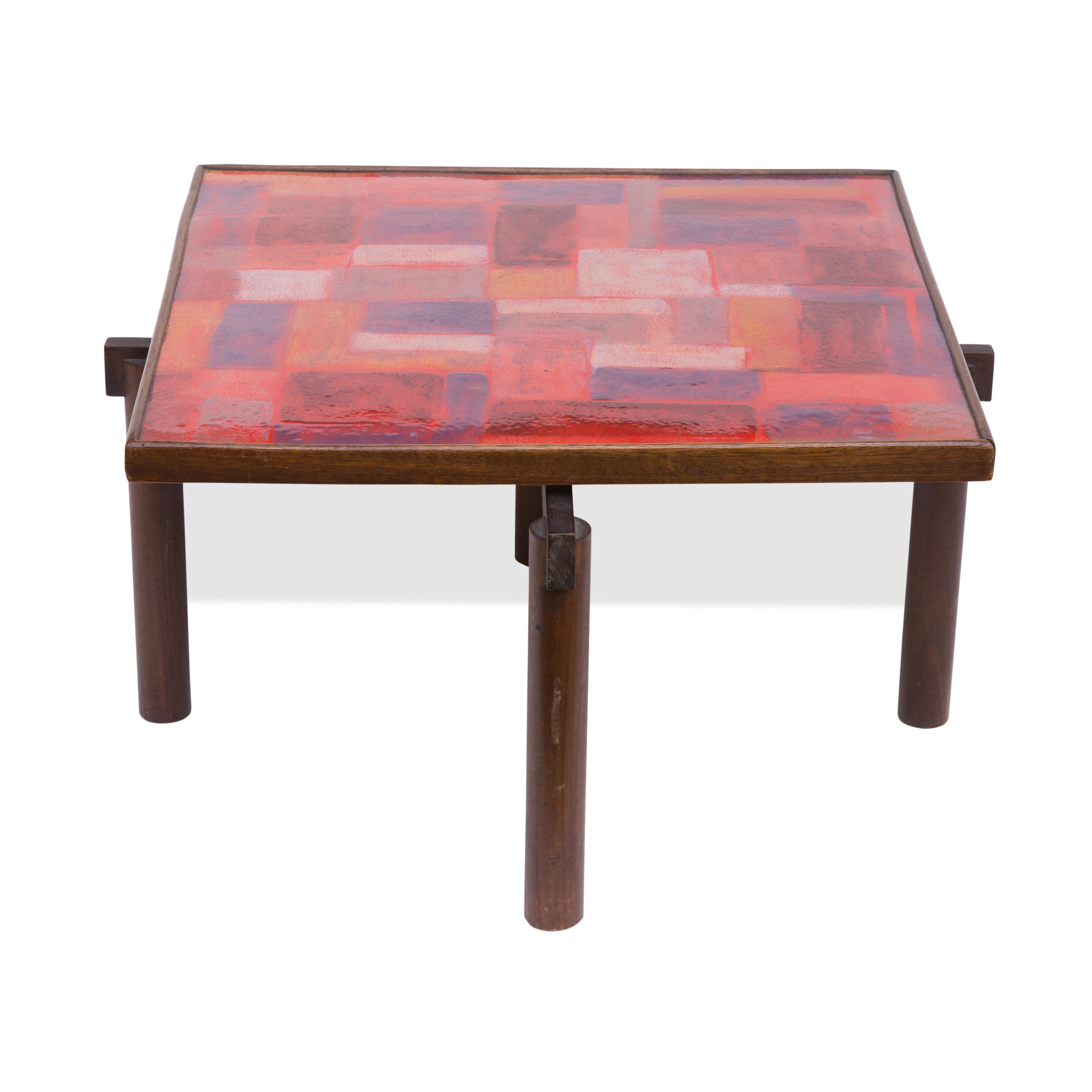 A really beautiful one off studio occasional table. 1960s Italian design Square shaped top with tones of abstract shapes in red, orange, purple, lilac colour enamelled metal top, wooden structure. 1960s Italian design by Siva Poggibonsi.