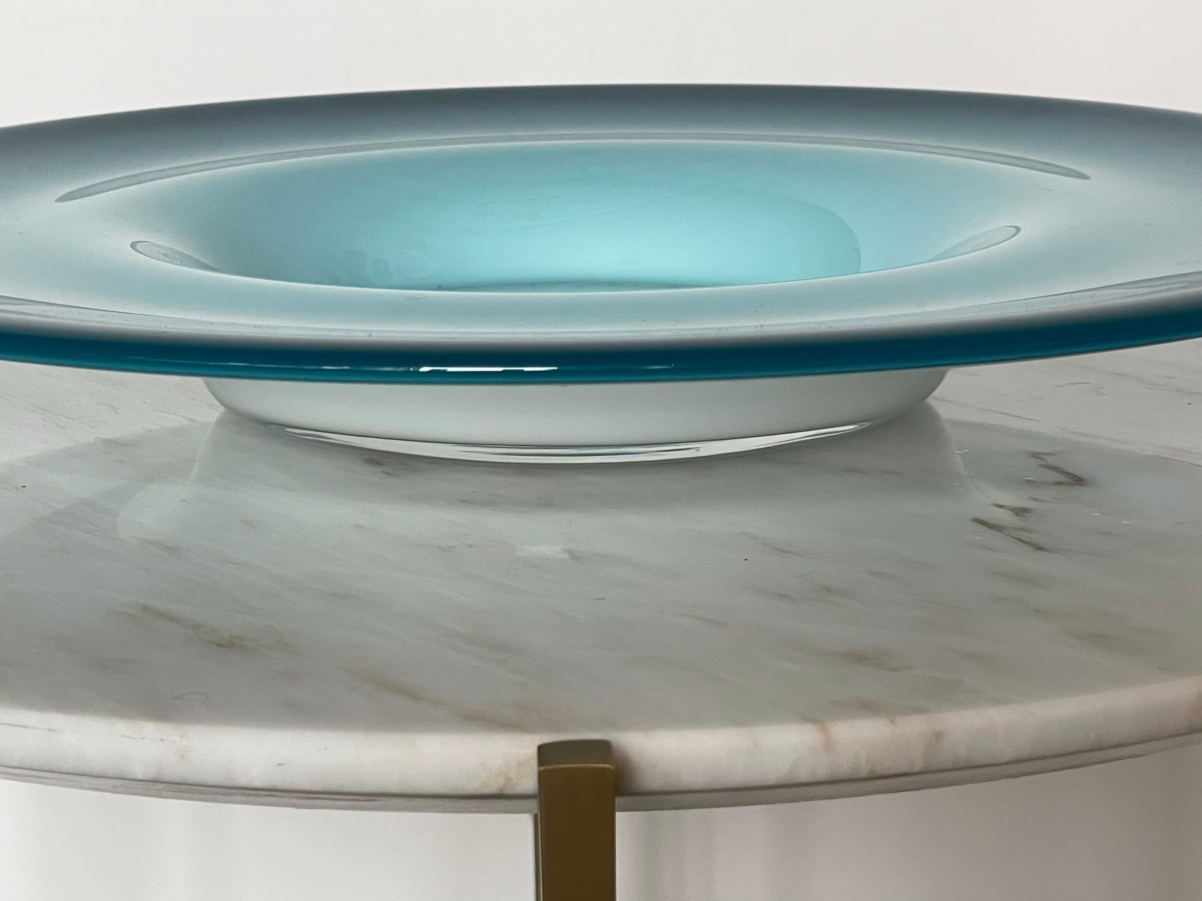 An Italian mid-century century vintage glass decorative dish, vide-poche or centerpiece in beautiful hues of blue and white. 
Italy, Circa 1960's. 



We are an exhibition space and an online destination established by the passionate art director