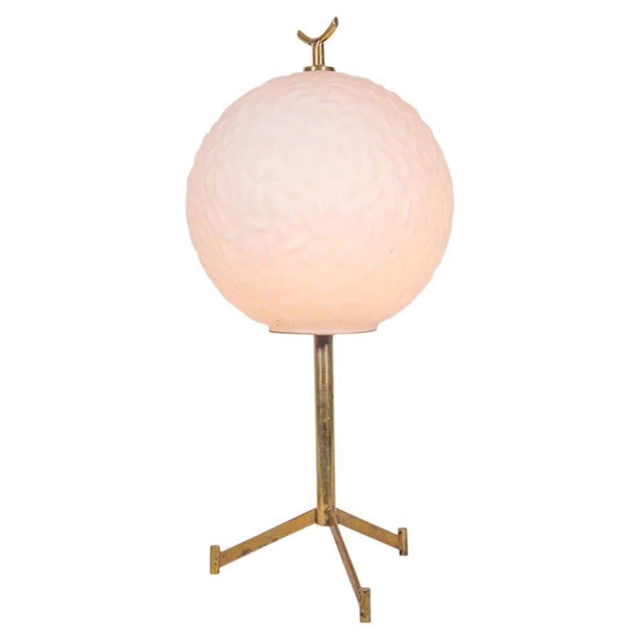 Vintage 1960s elegant white patterned satin glass globe pressed pattern shade on a brass tripod base and structure. Italian design attributed to Stilnovo. ca.1960s
Wired to work in Europe and US
Wattage : 40 Watts.
 