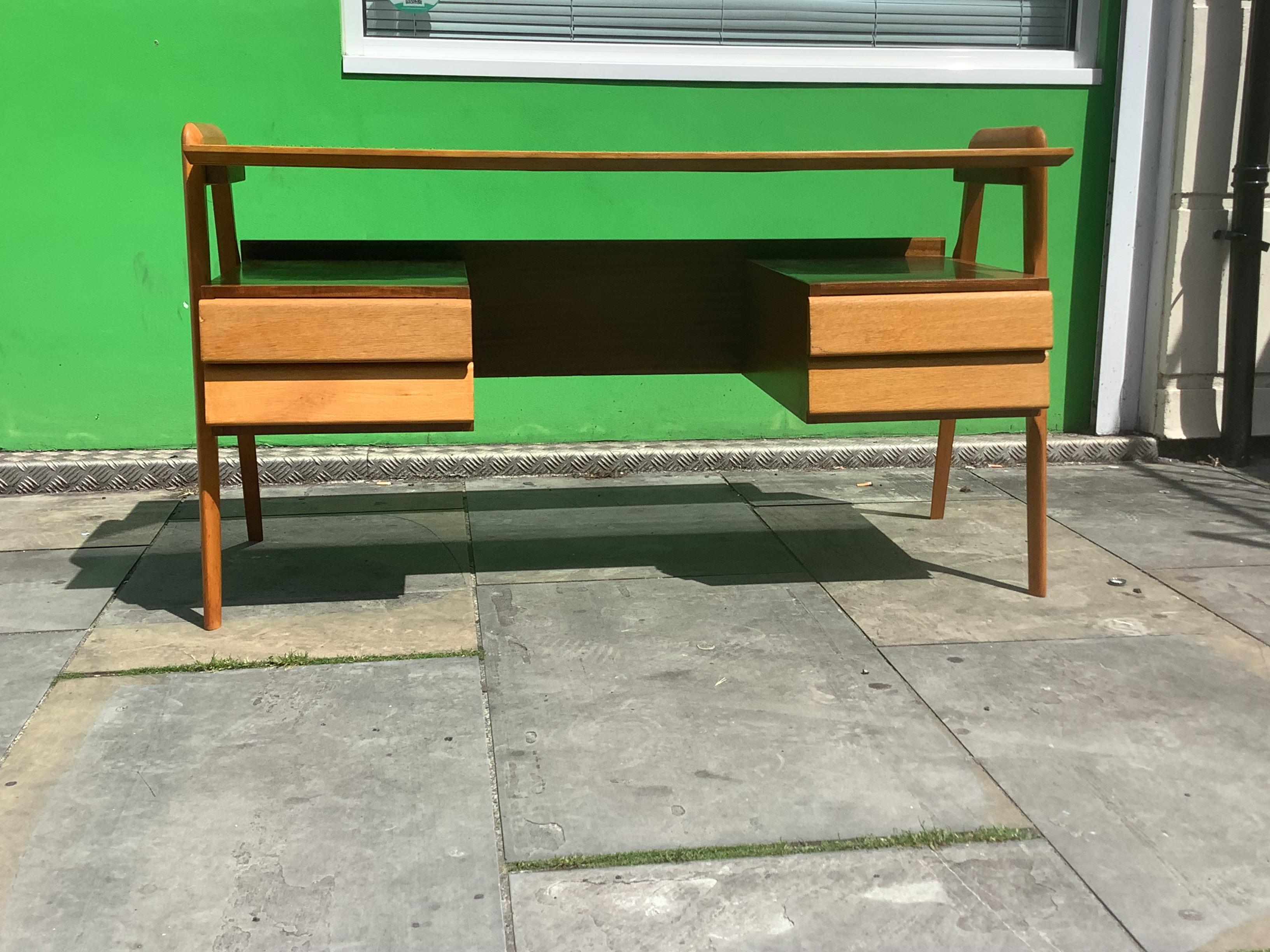 This unique and rare vintage desk design by Vittorio Dassi .
Wonderfully beautifully crafted frame and legs with four storage draws.
