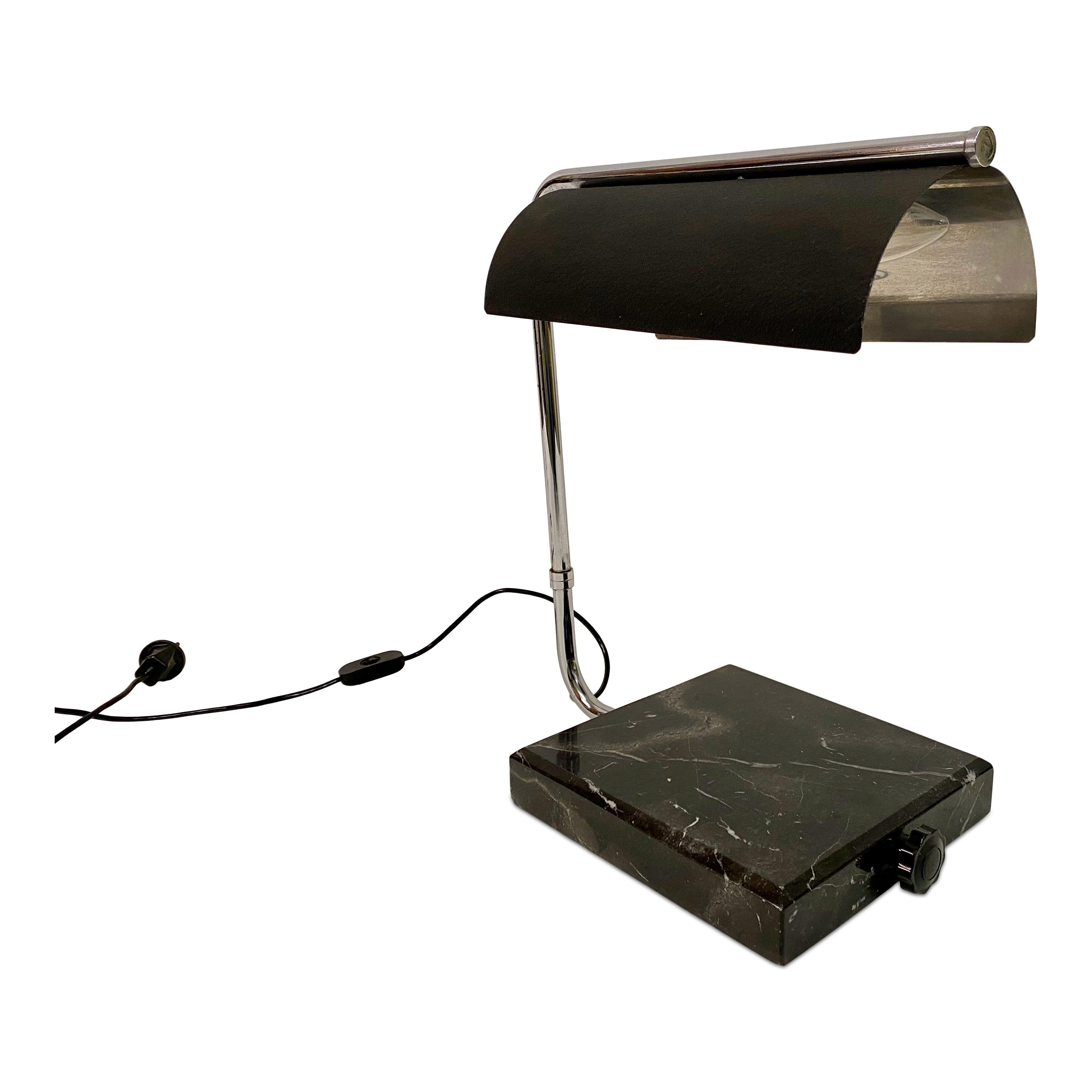 Desk lamp

Industrial look

Marble base

Black half cylindrical metal shade

Italy 1960s.