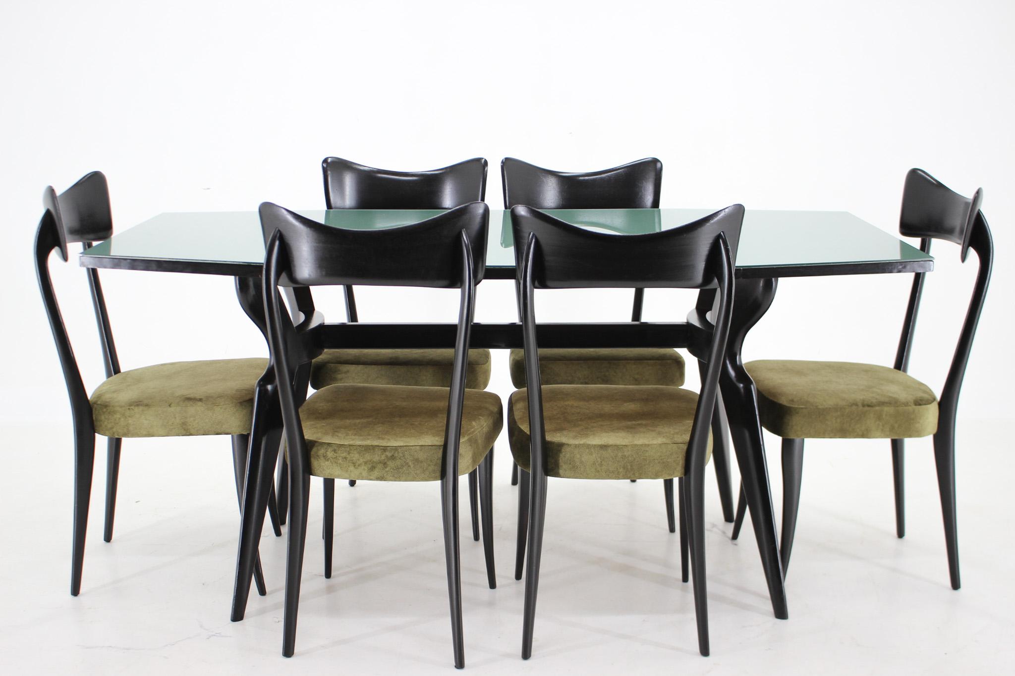 Beautiful set of dining table and six chairs in style of the famous Italian architect and designer Ico Parisi. Very good original condition. The chairs are very stable and newly upholstered in velvet fabric with easy cleaning technology. 
The