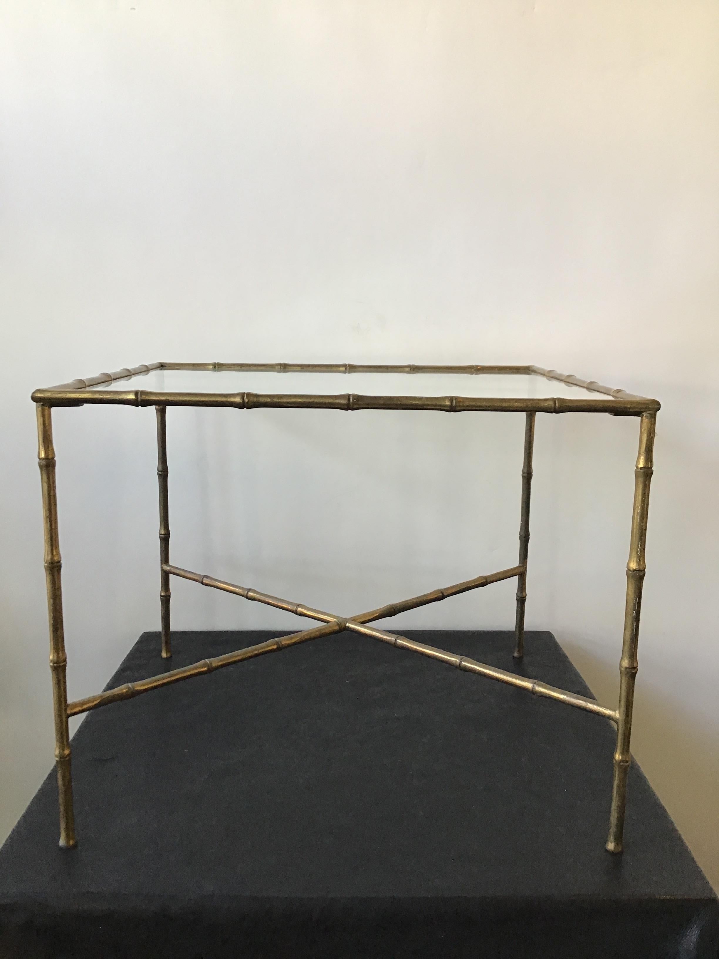 1960s Italian faux bamboo brass accent table with glass top.
This table can be shipped by UPS.