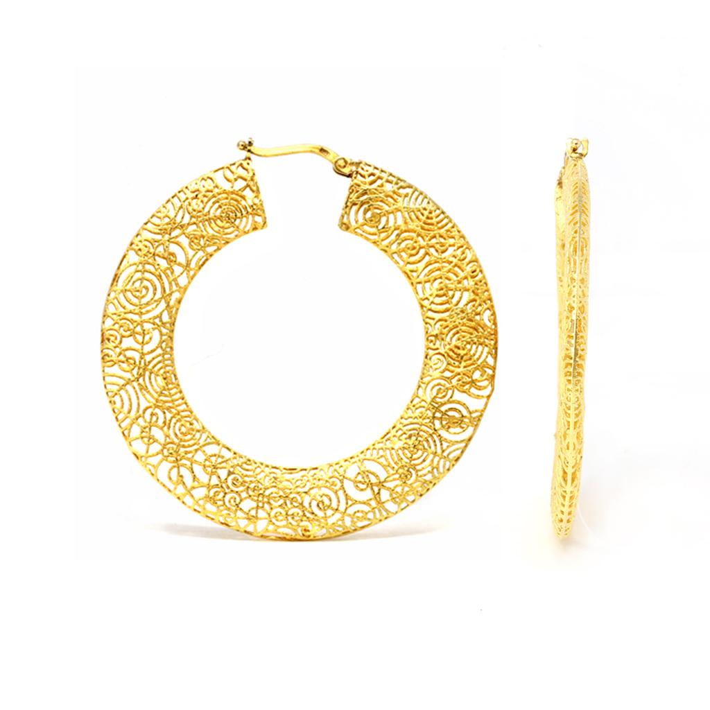 Pair of 14 karat yellow gold filigree earrings, Italian, circa 1960, designed as openwork hoops of circular and web patterns, gross weight 10.2 grams, measuring 1 7/8 by 2 by 1/8 inches.
A fun alternative to traditional hoop earrings with a unique