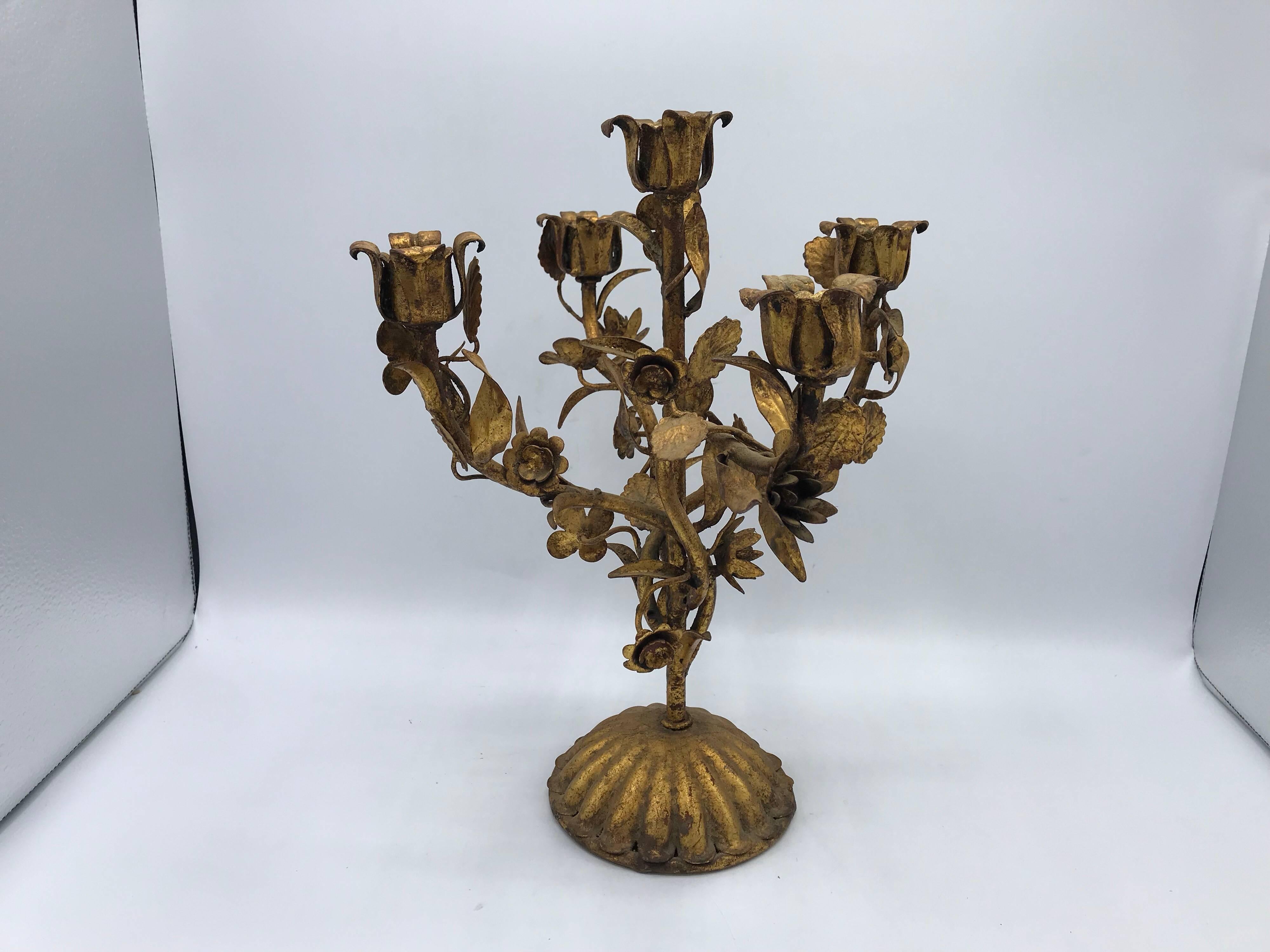 Listed is a stunning, 1960s Italian Florentine gilded-metal five-arm candelabra with a rose and vine sculptural motif.