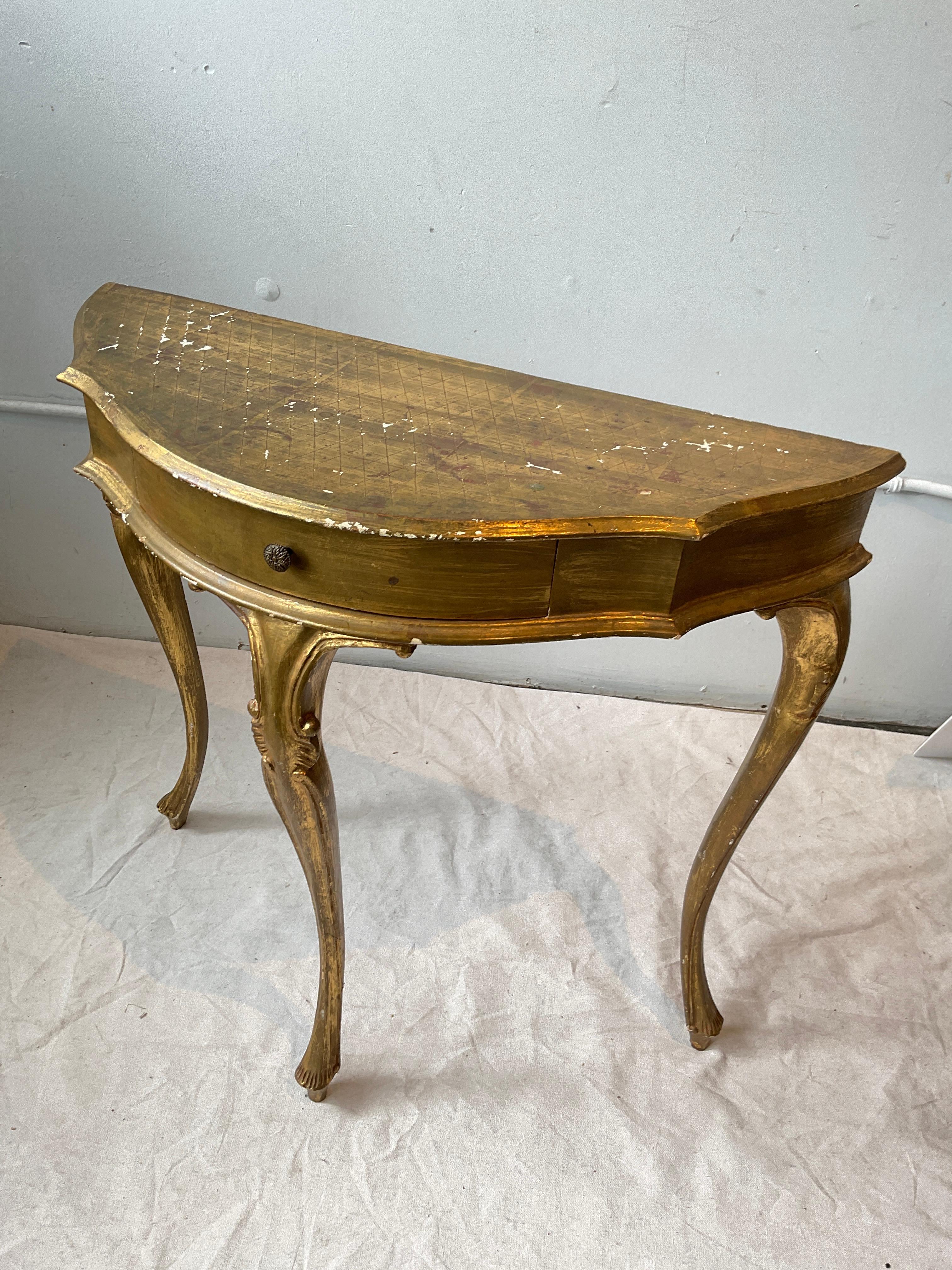 1960s Italian gilt wood console. Wear to finish as shown in pictures.