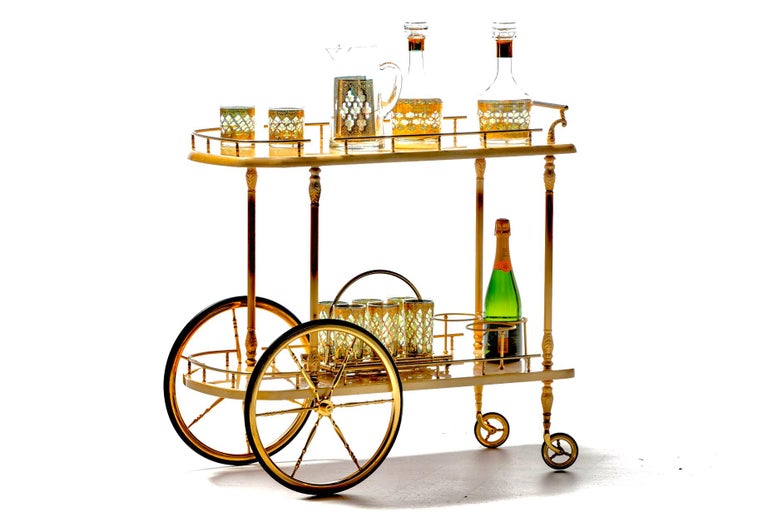 Elegant and stately 1960s ivory goatskin lacquer and brass bar cart imported from Italy. Aldo Tura bar carts are iconic and timeless. Classic European styling. The look of old money and refinement. Quality construction. Two large goatskin lacquer