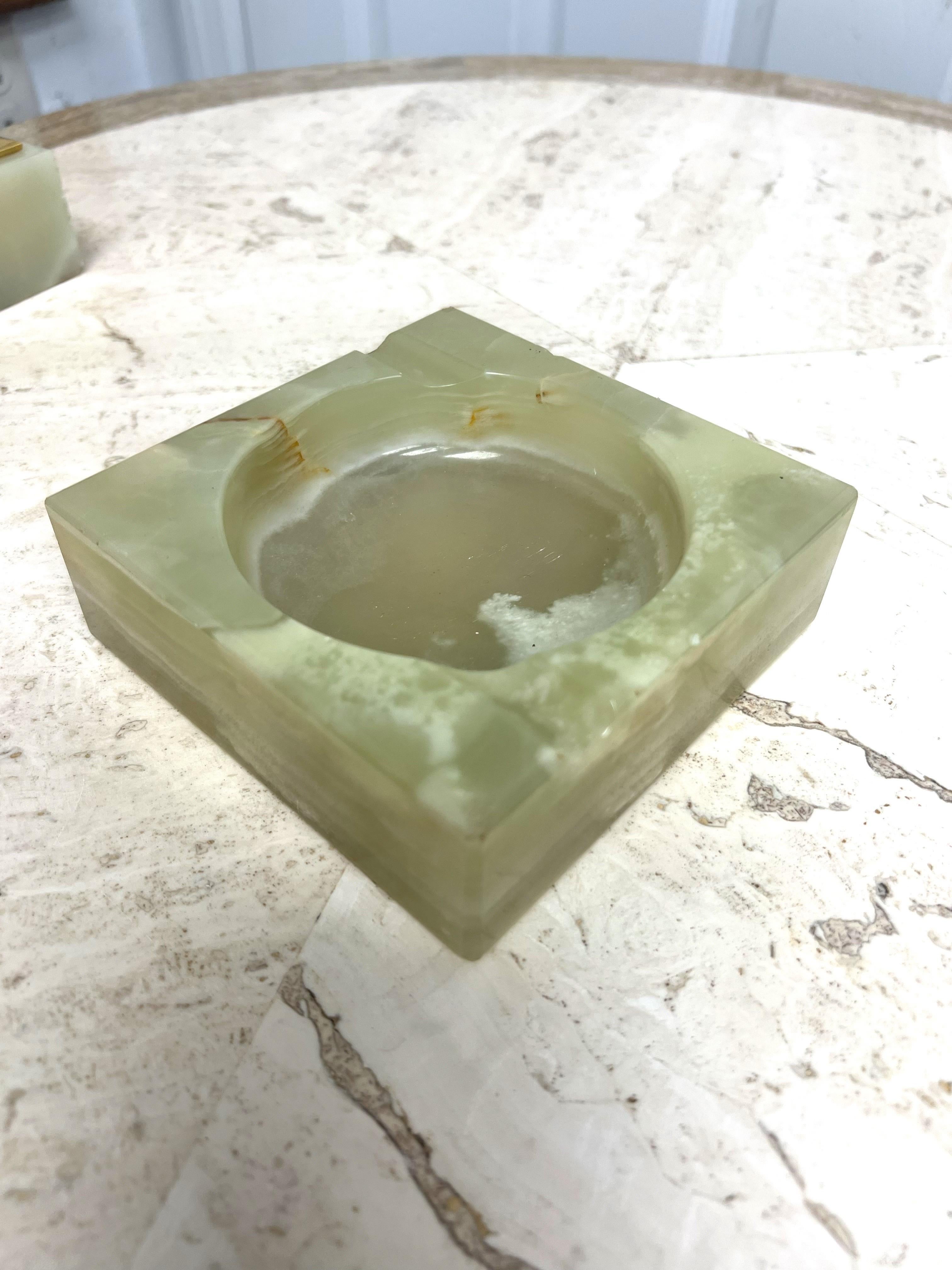 1960’s Italian Green Onyx Ashtray and Table Lighter Smoking Set - a Set of 2

A beautiful green onyx marble  ashtray and table lighter for the sophisticated or medicinal smoker.  This lovely set was made in Italy and still obtains the original