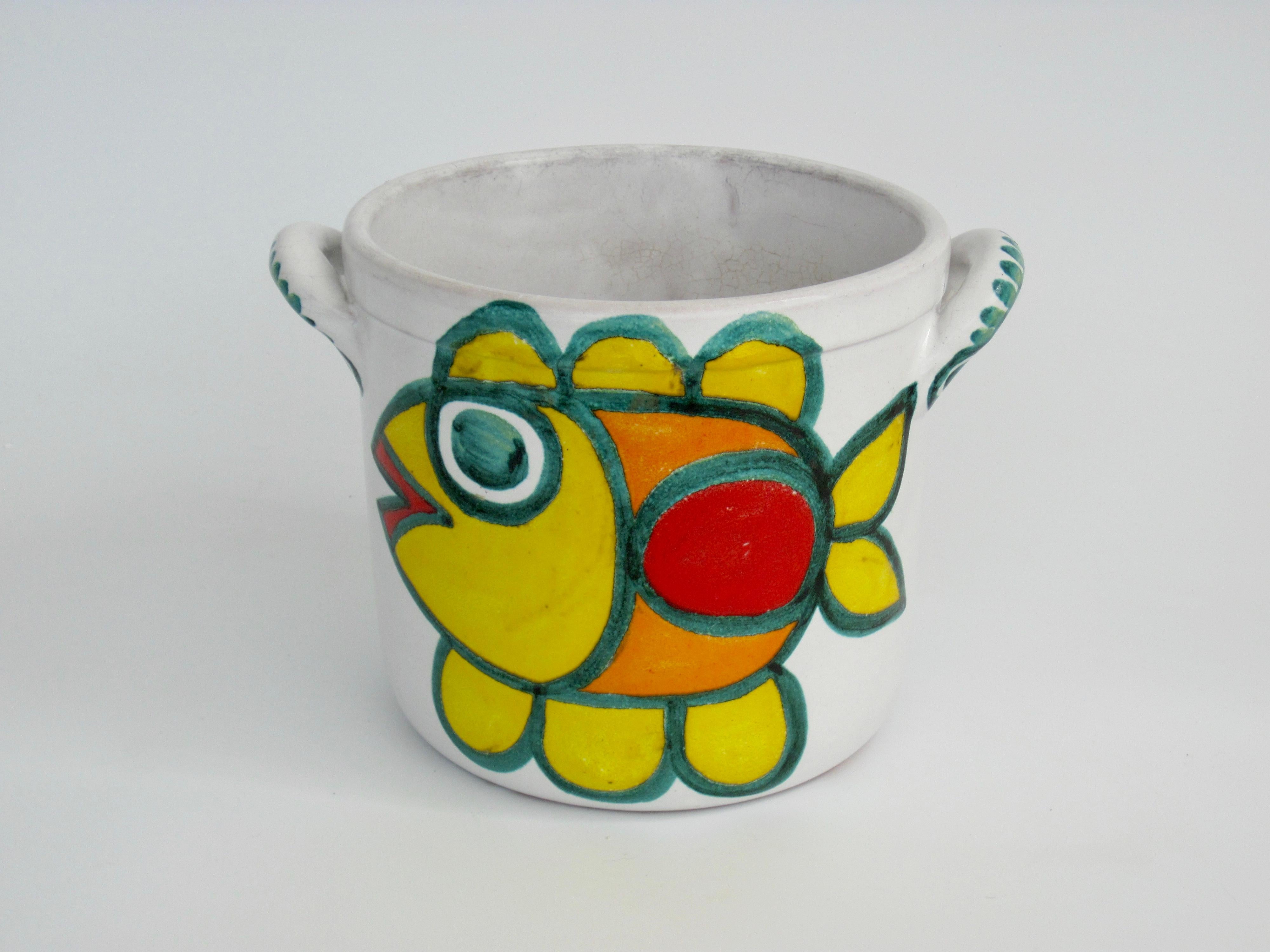 Two brightly colored hand painted fish on this handled planter pot by Giovanni DeSimone. Hand signed. 1960s, Italy. Measures 10.5
