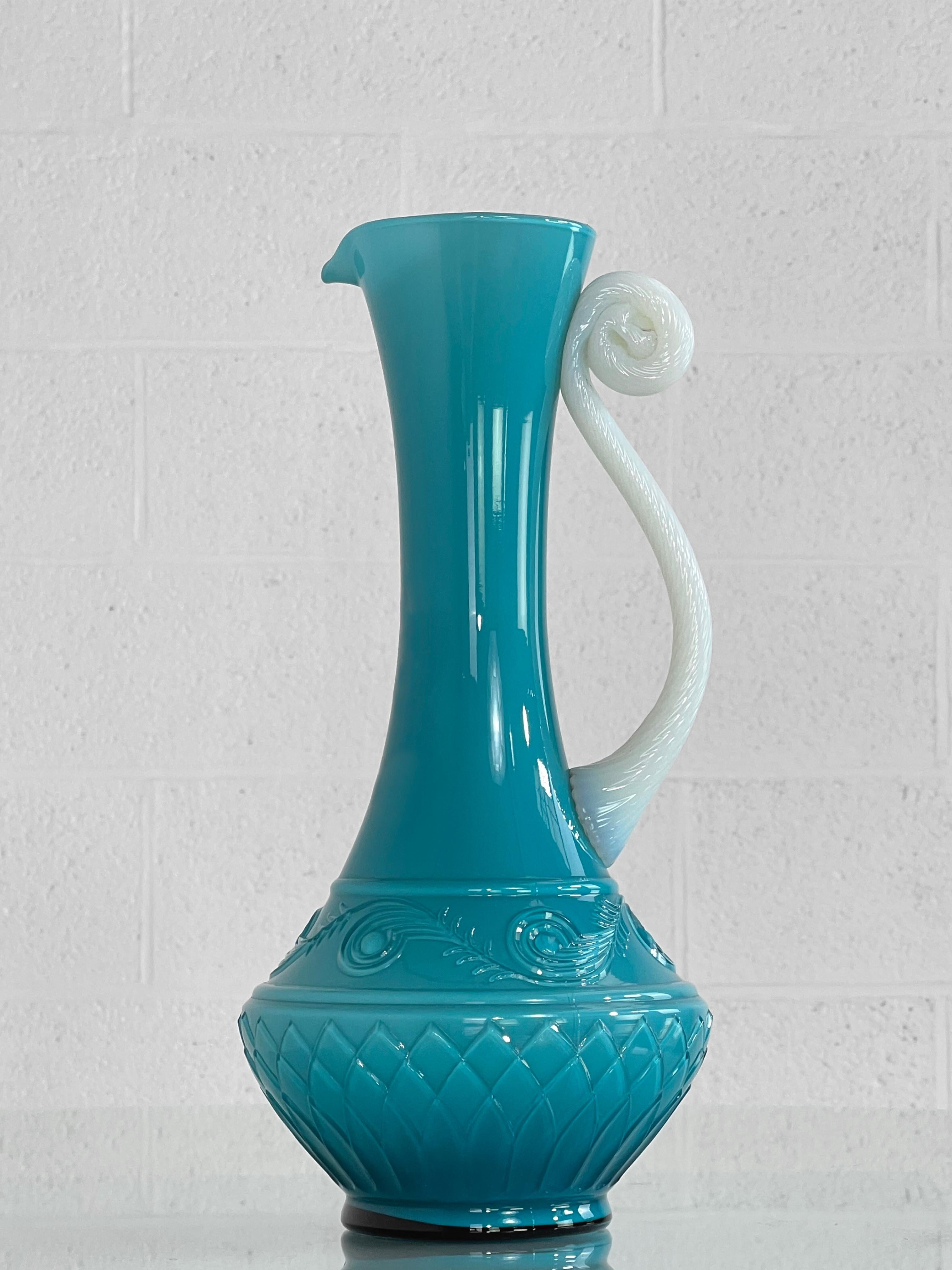 1960s Handmade Glass Pitcher Vase with turquoise color base sculpted glass adorned with a off white handmade handle