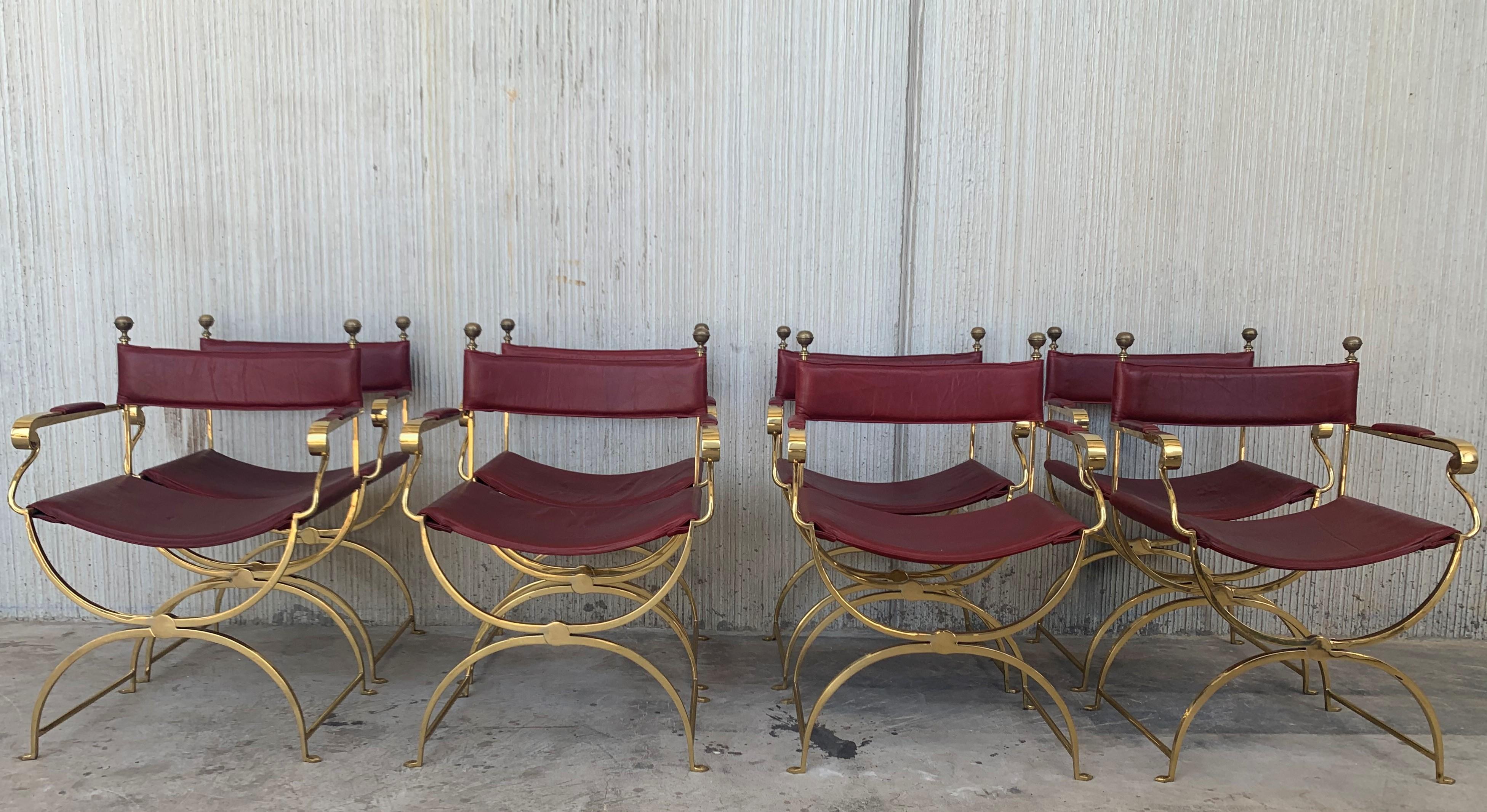 Set of eight beautiful 1980s Italian chrome gold and red leather Savonarola director's chair in perfect conditions, with very minor fading and great timeless patina.
Very comfortable armchair, quilted in back and seat.
Size: Height to the arm