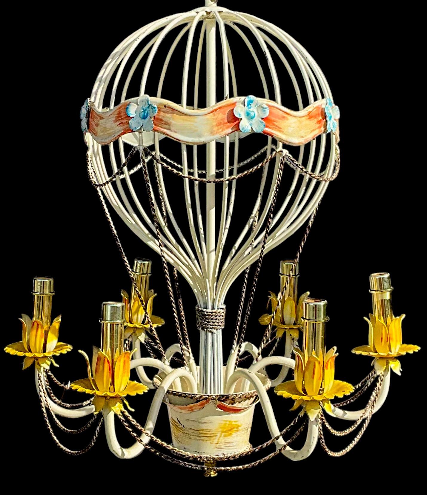 This is such a nice fixture! It is a mid-century Italian tole hot air balloon chandelier with French styling. It has 6 arms and 38” of chain. The brass cap is 5.25” in diameter. Note the power switch in the last photo. I can have it removed if so