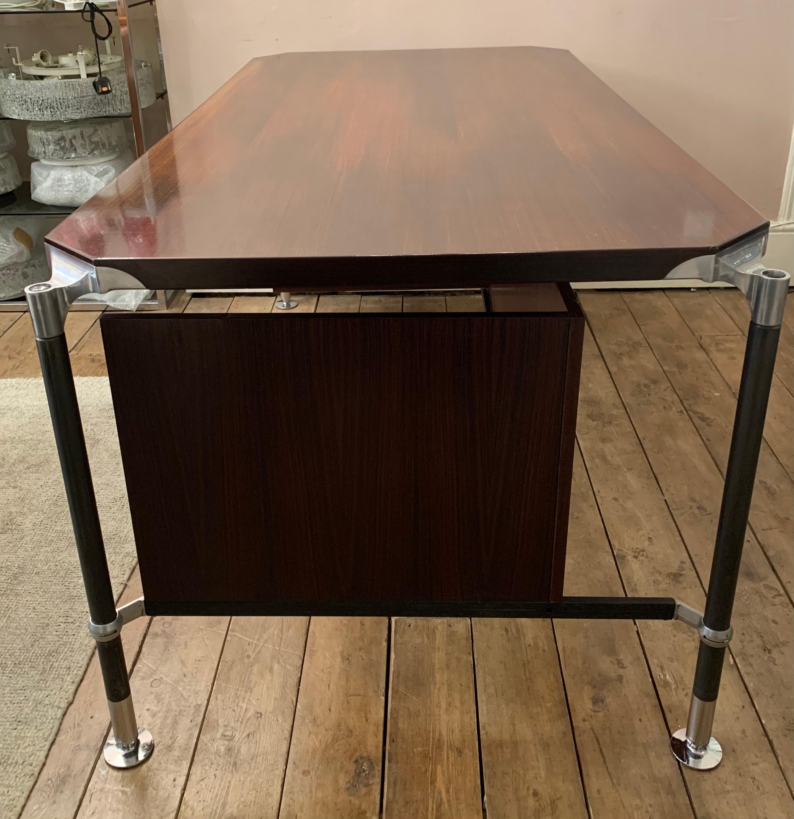 A very large Italian 'President's' office desk designed by Ico & Luisa Parisi for MIM Italy during the 1960s. The polished rosewood desk top is supported by beautifully detailed aluminium corner joints which the black-lacquered steel legs connect