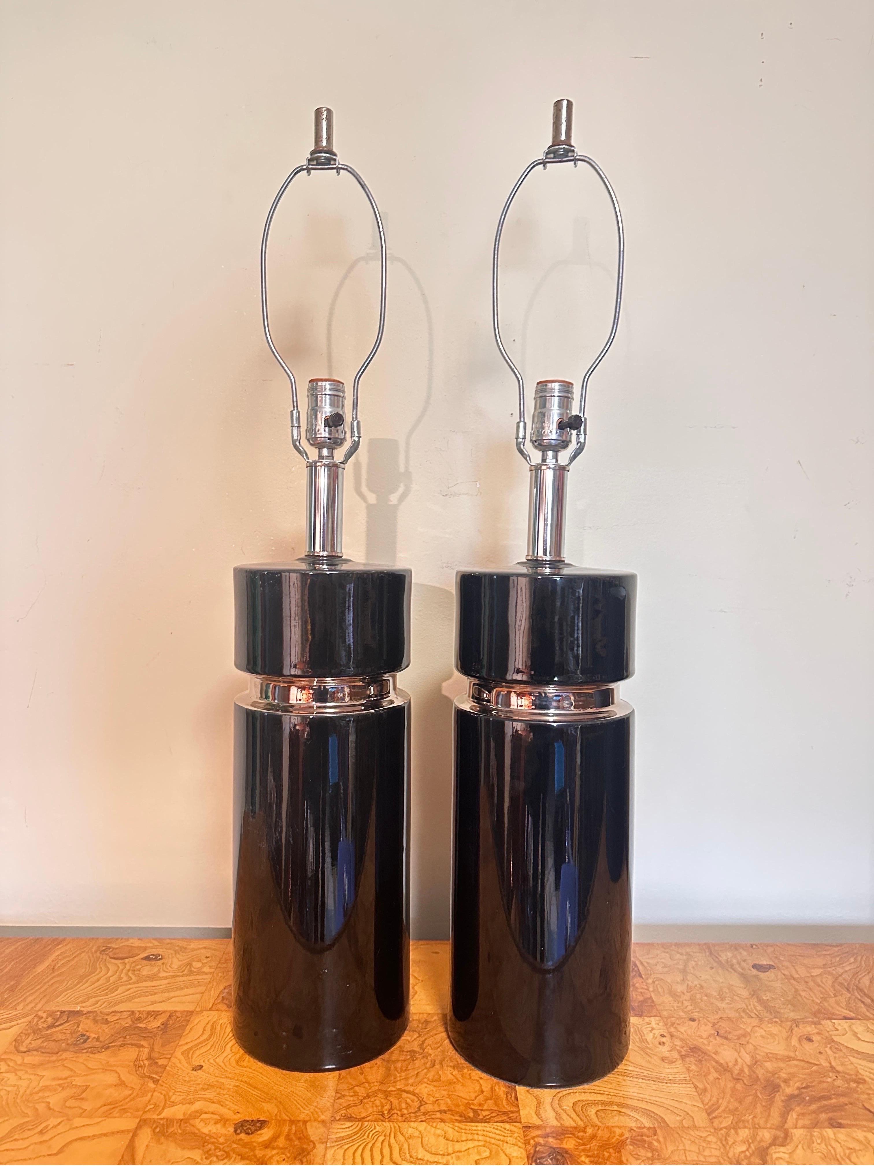 Exceptionally sleek showing authentic vintage charm. Attributed elsewhere to ‘Pierre Cardin’ but not marked. Glossy glaze of black and silver chrome. Chrome neck and finials. 1960s or 1970s production era.

(Pictured with modern lampshades measuring