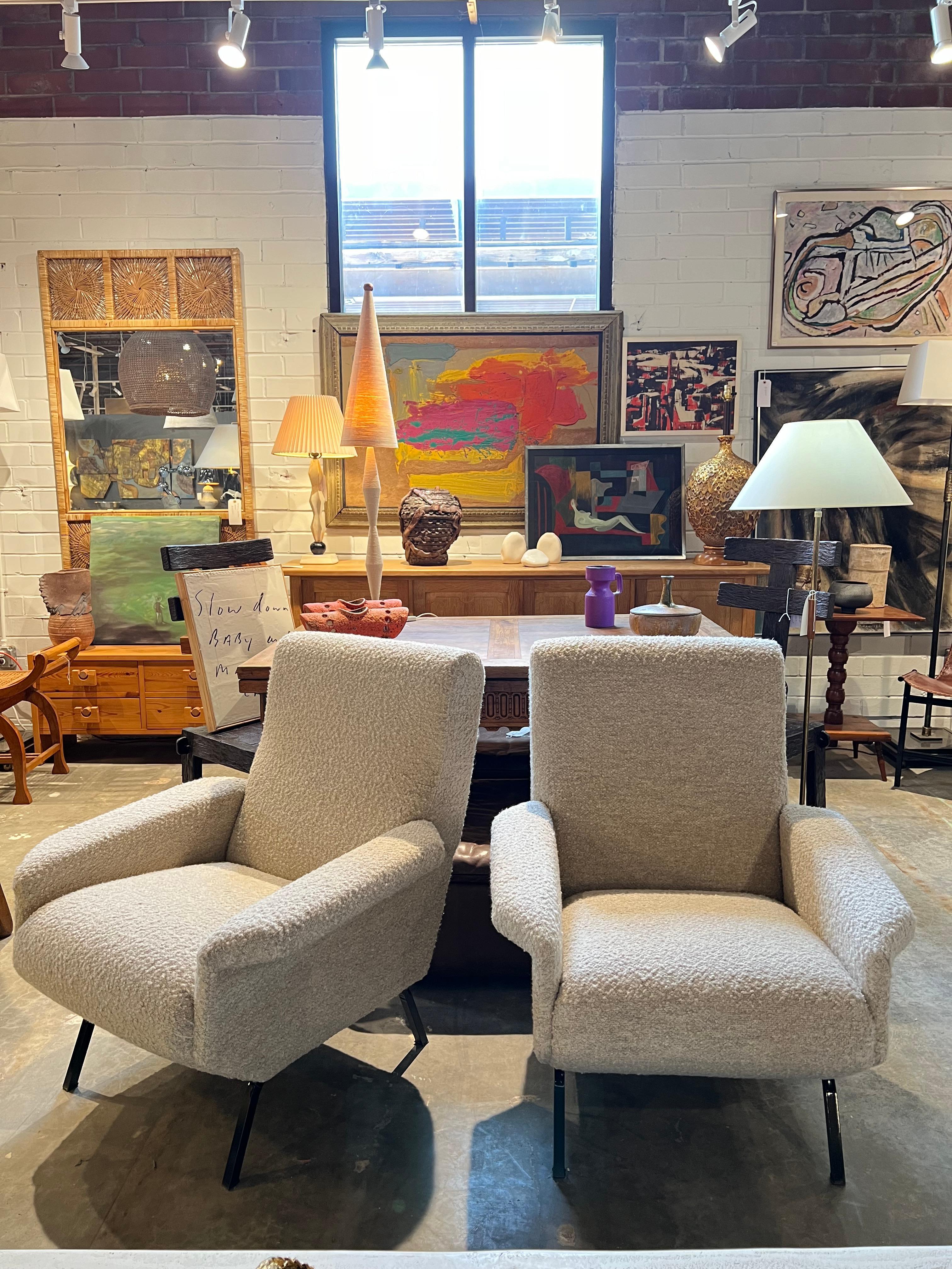 Pair of midcentury Italian lounge chairs with new Italian Boucle upholstery and metal
Legs. 