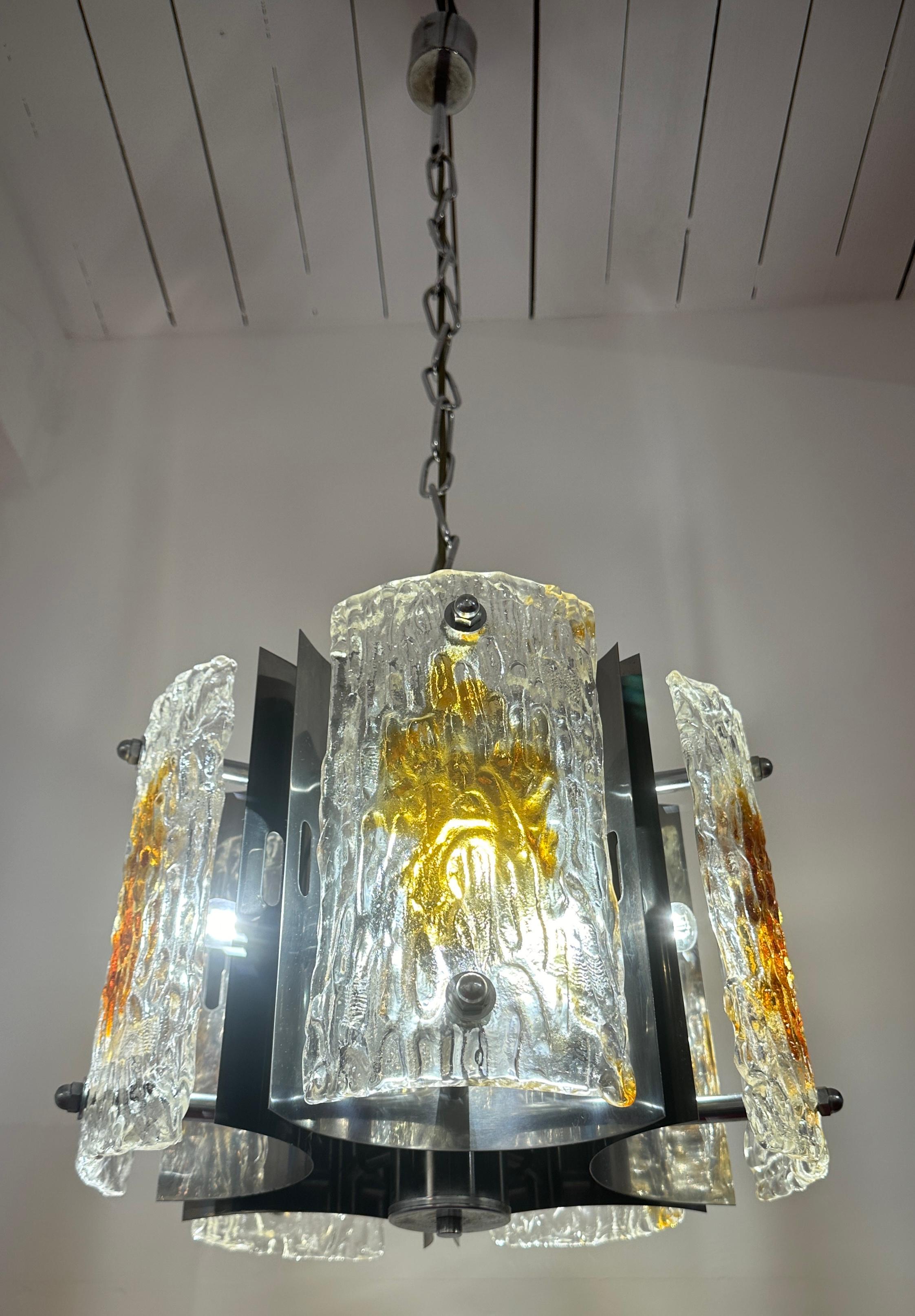 An eye-catching and striking 1960s Italian pendant hanging light designed by Carlo Nason for Mazzega.  The pendant is constructed from five convex, slightly curved, rectangular polished chromed-metal plates with five corresponding concave pieces of