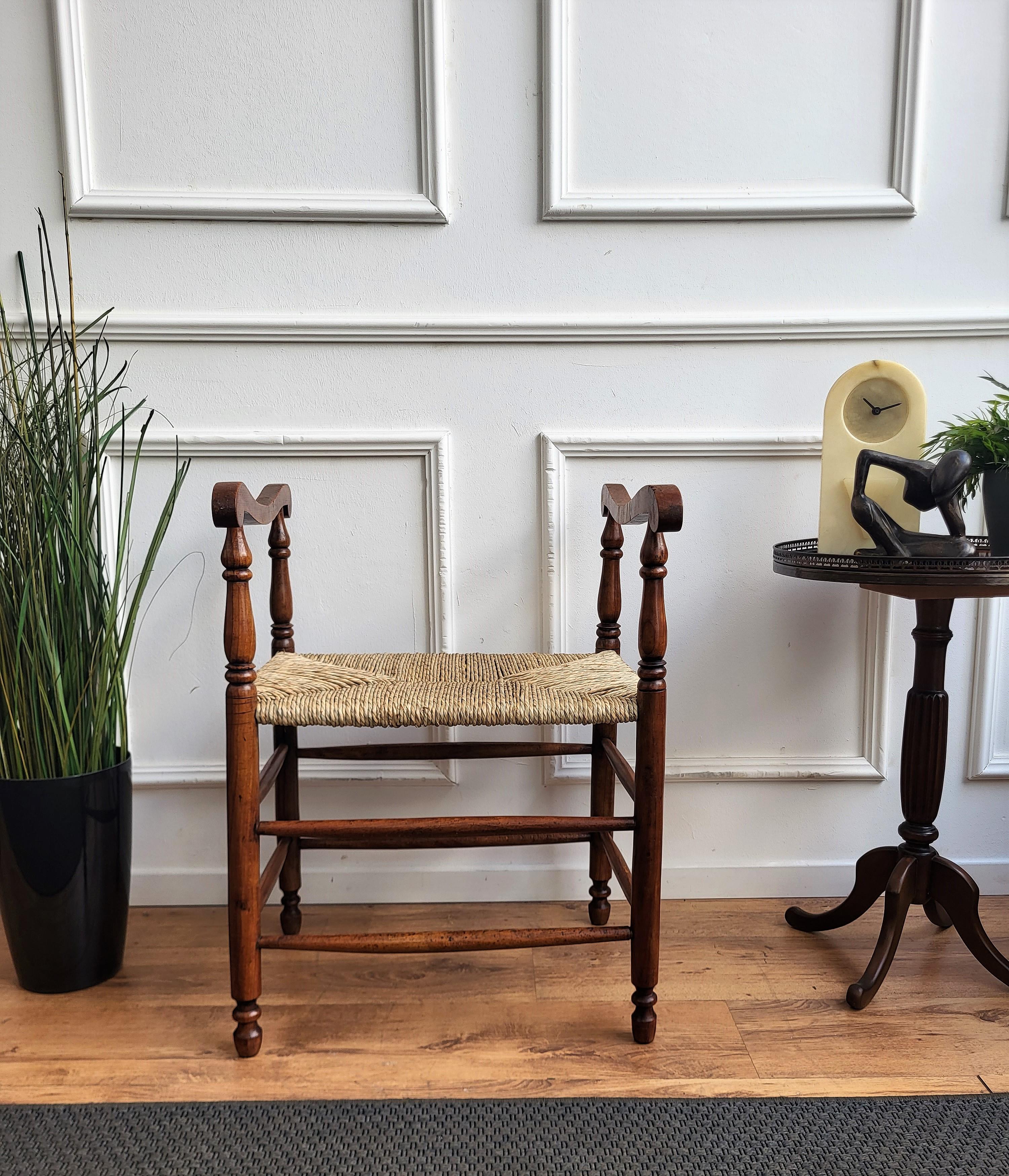 Stylish and beautiful 1960s Mid-Century Modern stool in wood and cord or woven rope, in the style of Audoux Minet with carved decorated wooden structure. The traditional and classical design and shape of the wooden structure, typical of Mid-Century