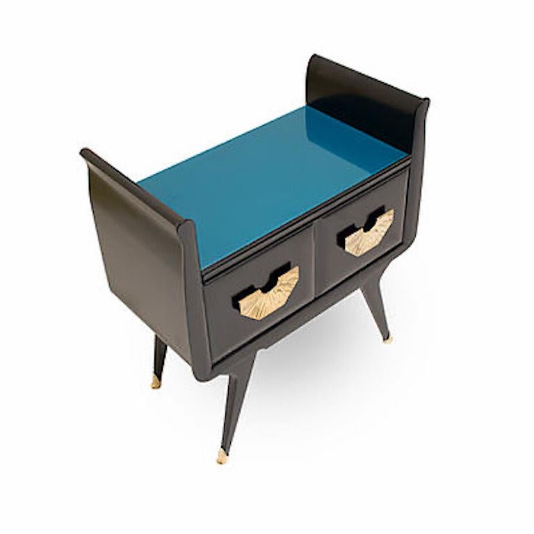 Pair of Italian vintage side tables, entirely handmade in Italy, ideal as bedside in a bedroom or next to a sofa for their functionality with a glass surface in a sophisticated teal blue color. High quality of construction with a black lacquered