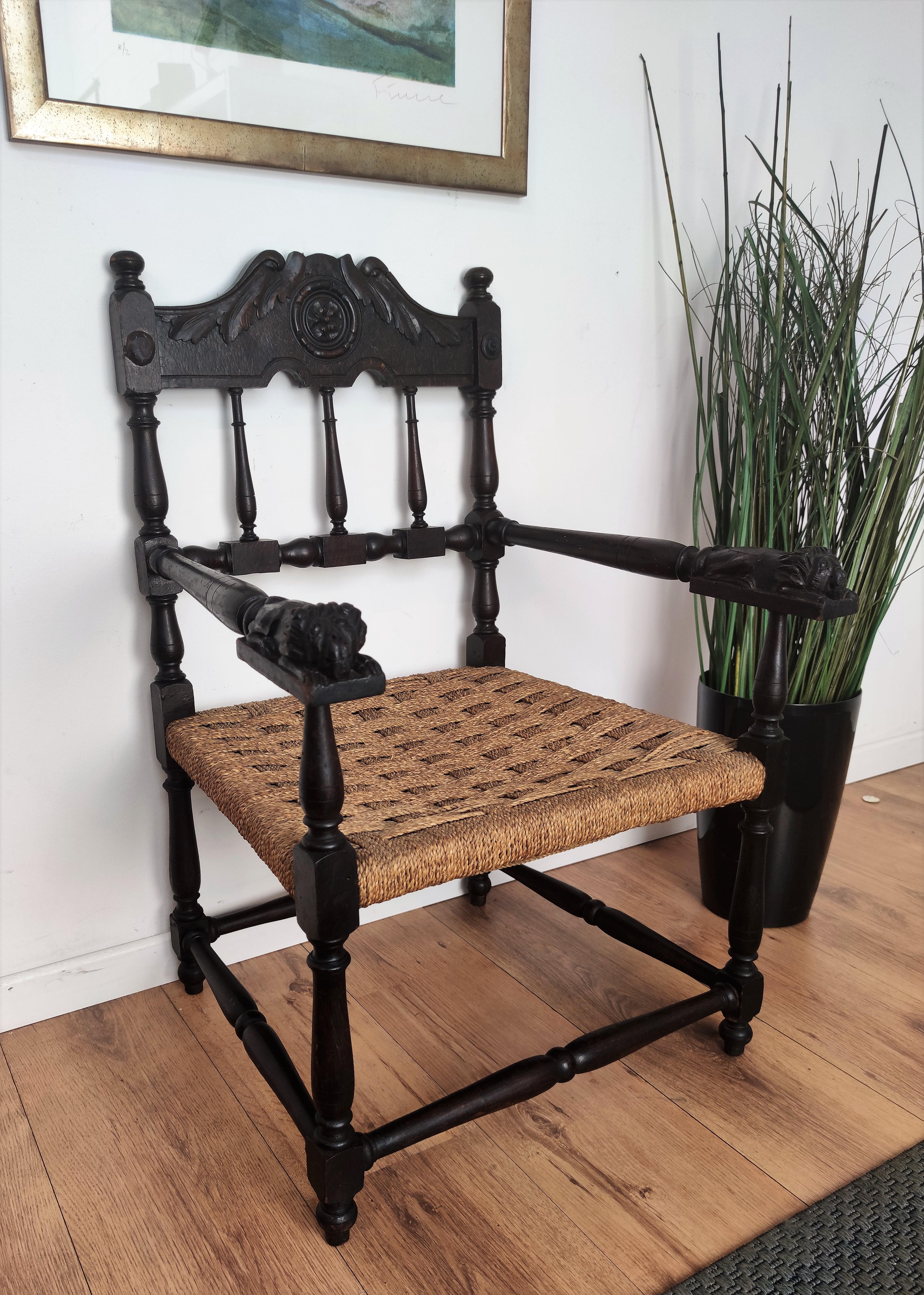 Stylish 1960s Mid-Century Modern armchair throne in wood and cord or woven rope, in the style of Audoux Minet with carved decorated back. The traditional and classical design and shape of the wooden structure, typical of Mid-Century Modern style,