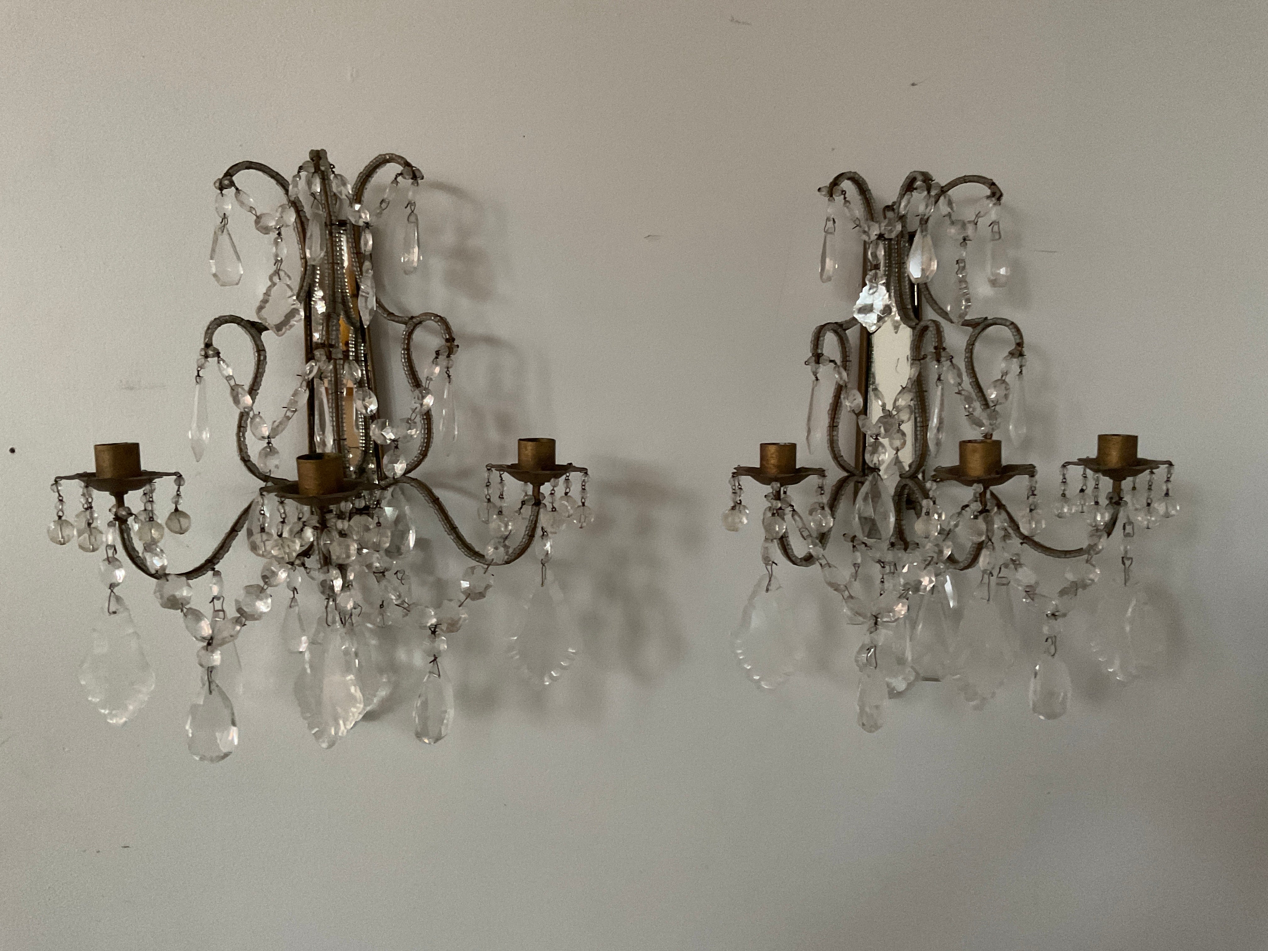 Italian mirrored back beaded sconces. There are no wires. In order to wire these you would have to do a French Wire. The wire would have to run along the arm.