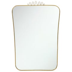 Specchio da parete in ottone modernista italiano del 1960