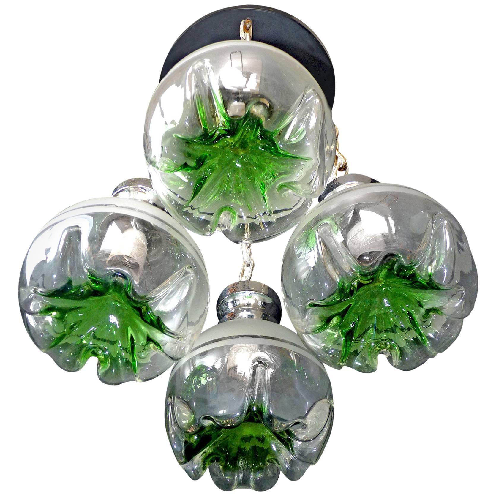 Unusual vintage 1960s Italian modernist Murano Mazzega era art glass chrome Cascade chandelier or glass pendant
Measures: Globe/diameter 8 in. (20 cm).

Measures:
Diameter 20 in / 50 cm
Height 32 in / 80 cm
Weight 22 lb/ 10 Kg
Four light bulbs E14/