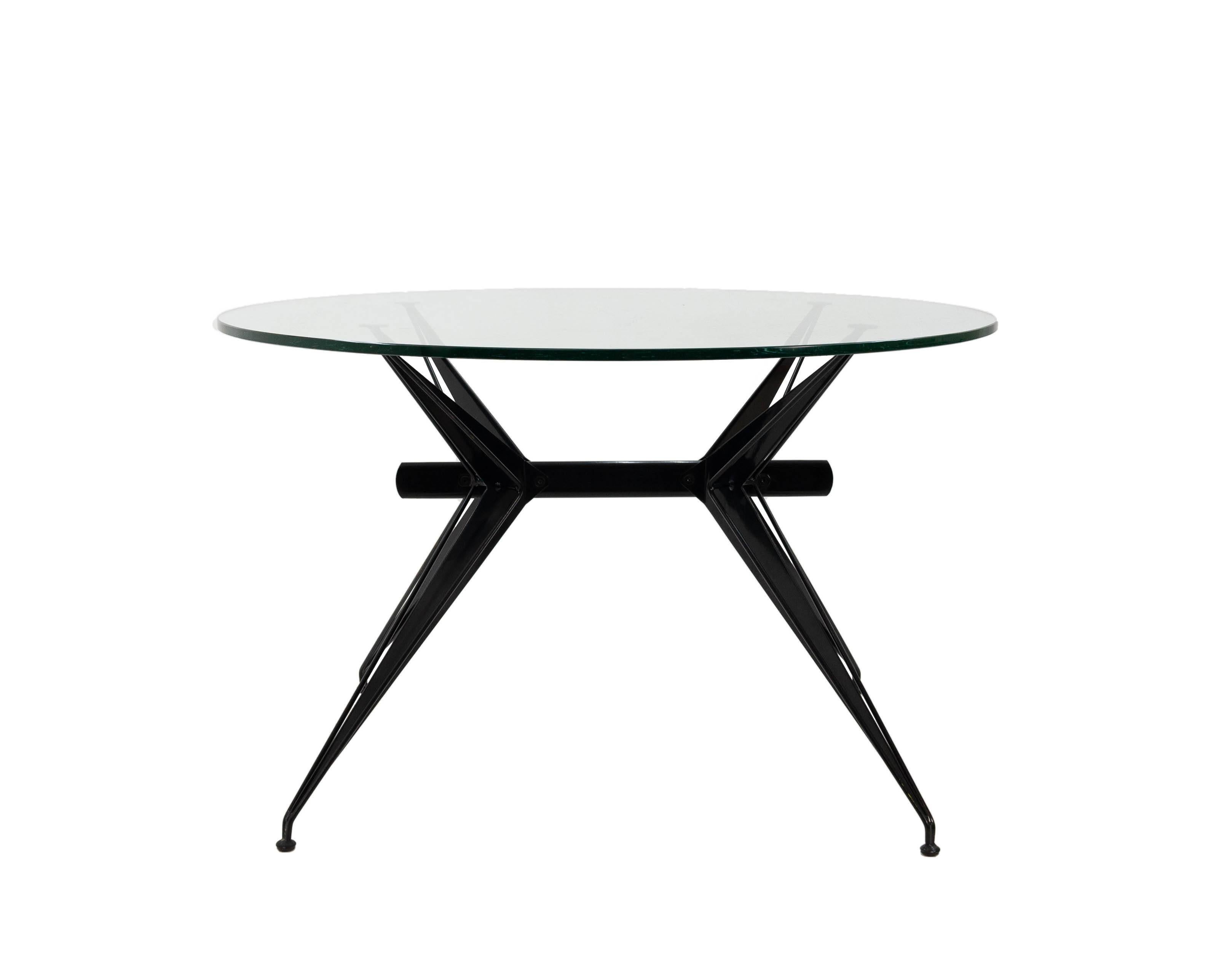 Striking Italian modernist table in the style of Osvaldo Borsani's works for Tecno. Intricately shaped steel construction with the original 3cm thick cut-glass top.