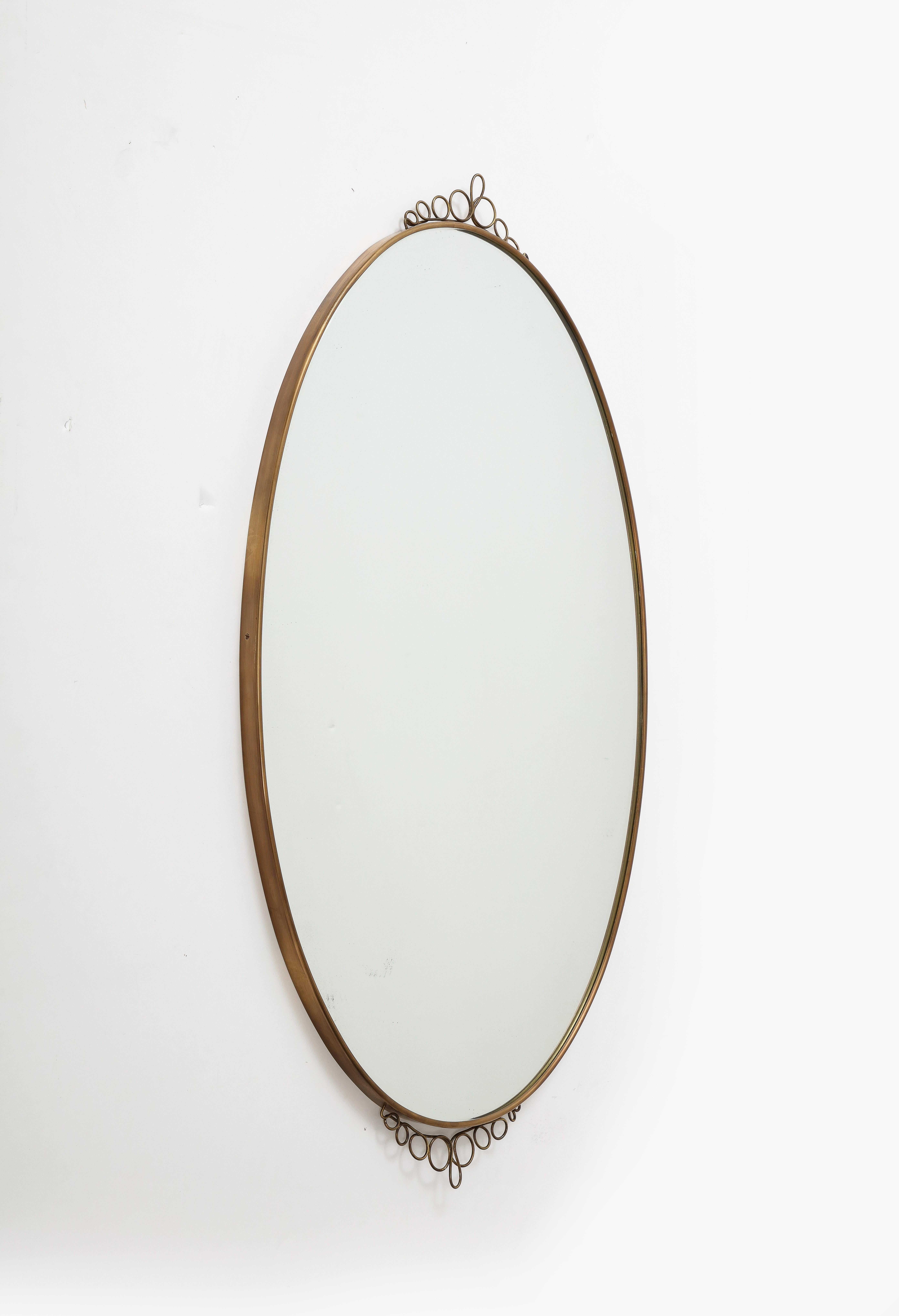 1960s Italian Modernist Oval Brass Wall Mirror with Scrolls In Good Condition In New York, NY