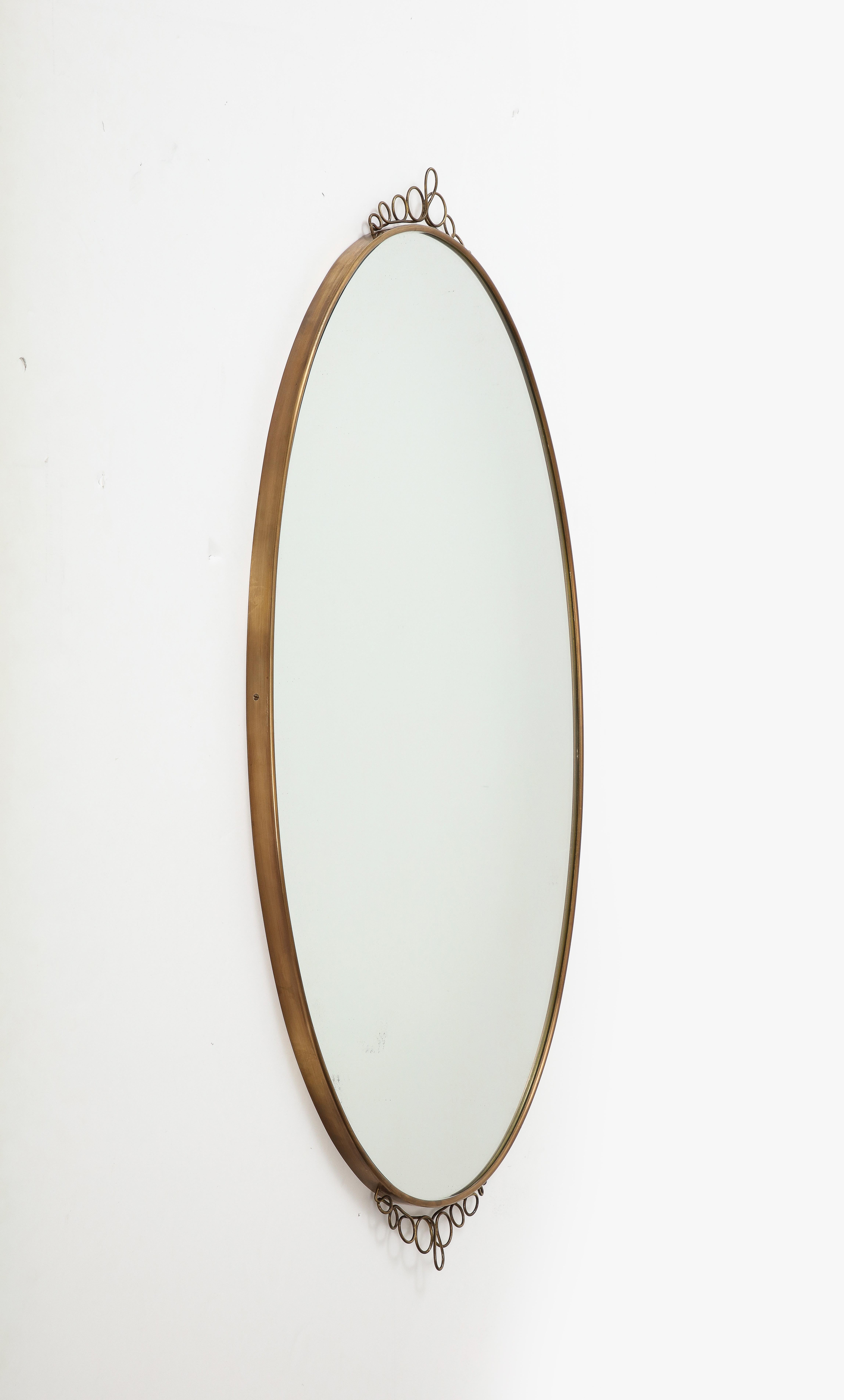 Mid-20th Century 1960s Italian Modernist Oval Brass Wall Mirror with Scrolls