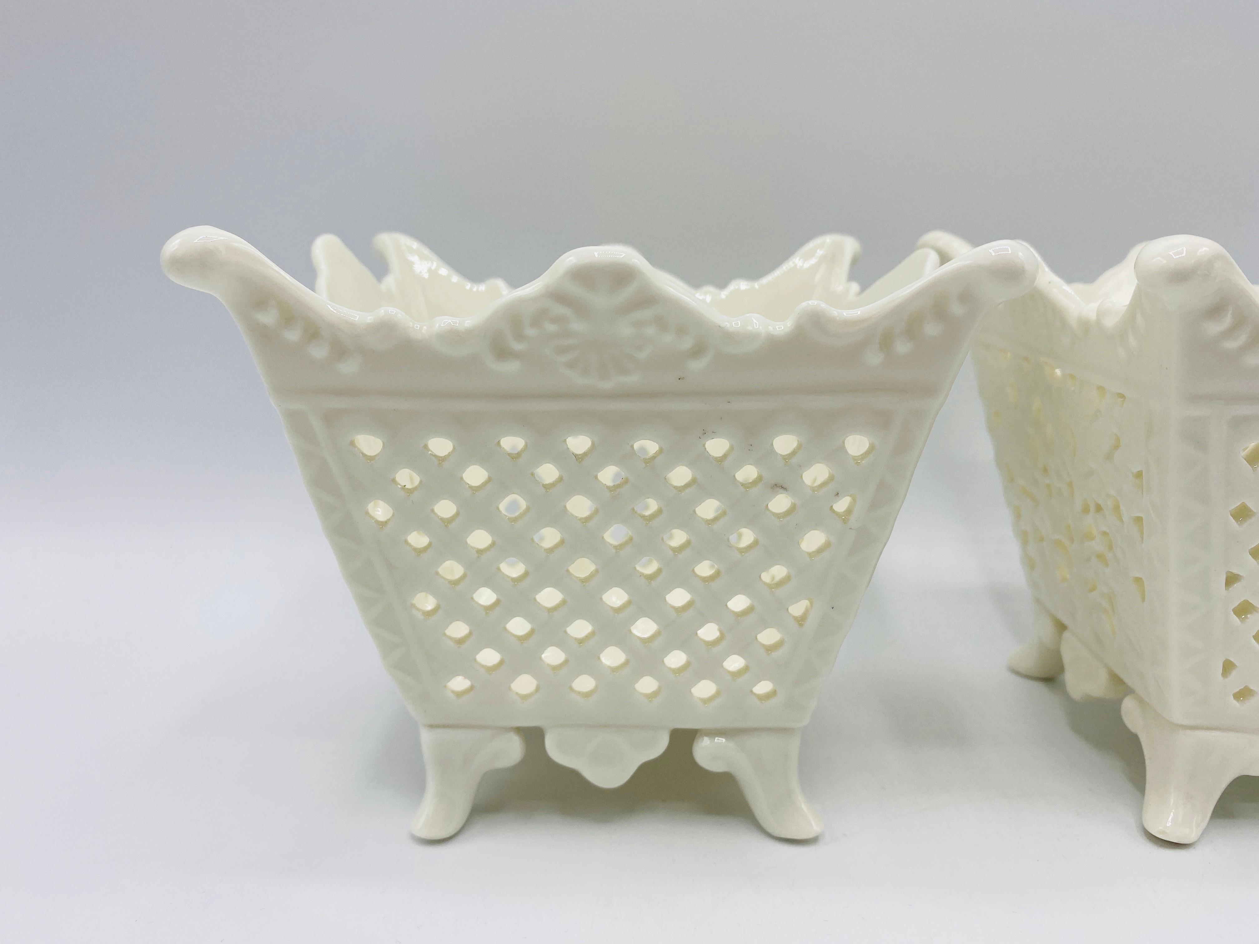 Listed is an absolutely fabulous, pair of 1960s Italian pierced porcelain cachepot planters. The pair have a gorgeous, overall scalloped shape, with a pierced lattice weave on two of four sides, and a pierced floral motif on the other two of four