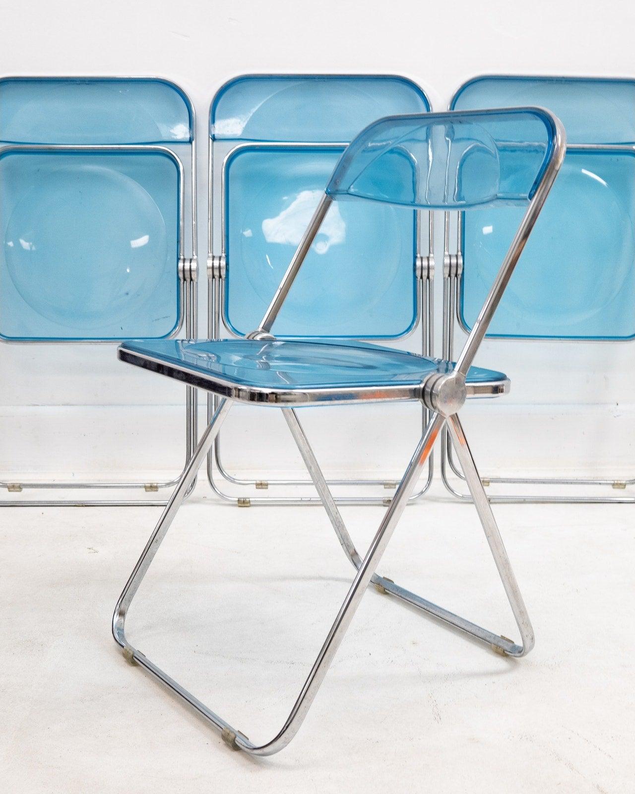 18.5” wide x 30” high x 20” deep. Seat height: 17.5”


1960s folding chrome and blue lucite chairs by Giancarlo Piretti for Castelli. Made in Italy. Labeled with a tag on each chair. Good condition with some minimal scuffs and scratches to seat and
