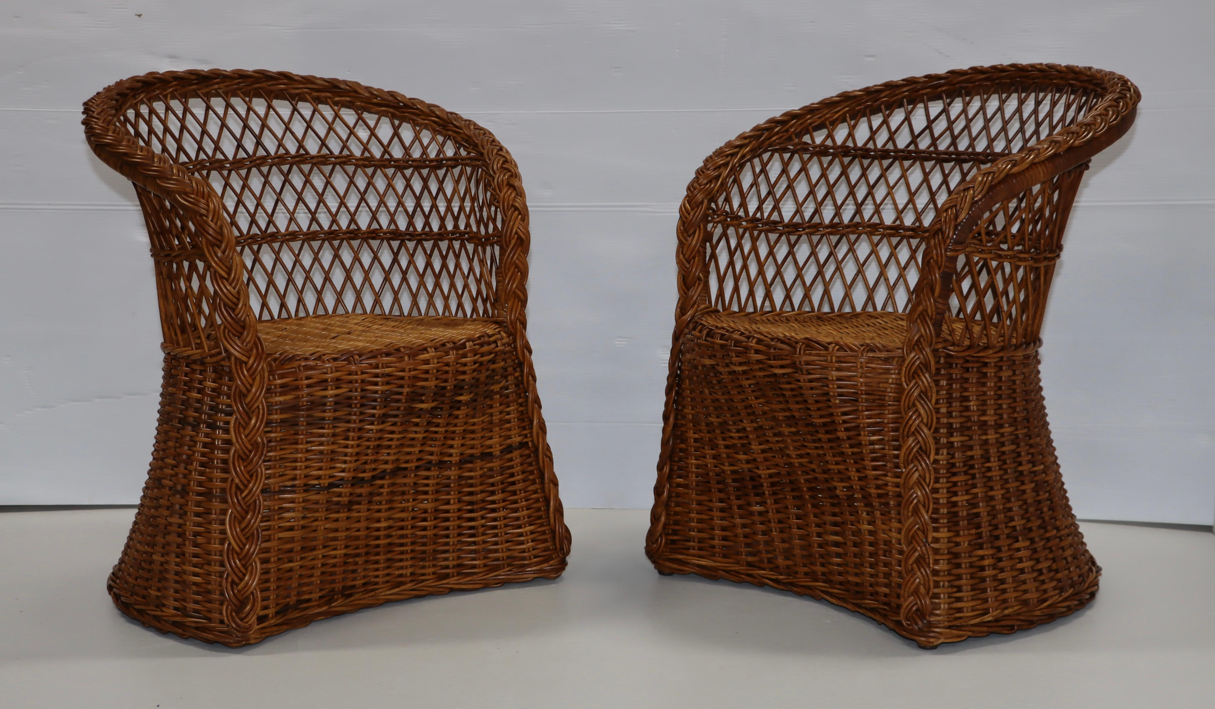 1960's modern Italian rattan lounge chairs with new Bouclé fabric upholstery, lightly restored with minor wear and patina due to age and use.