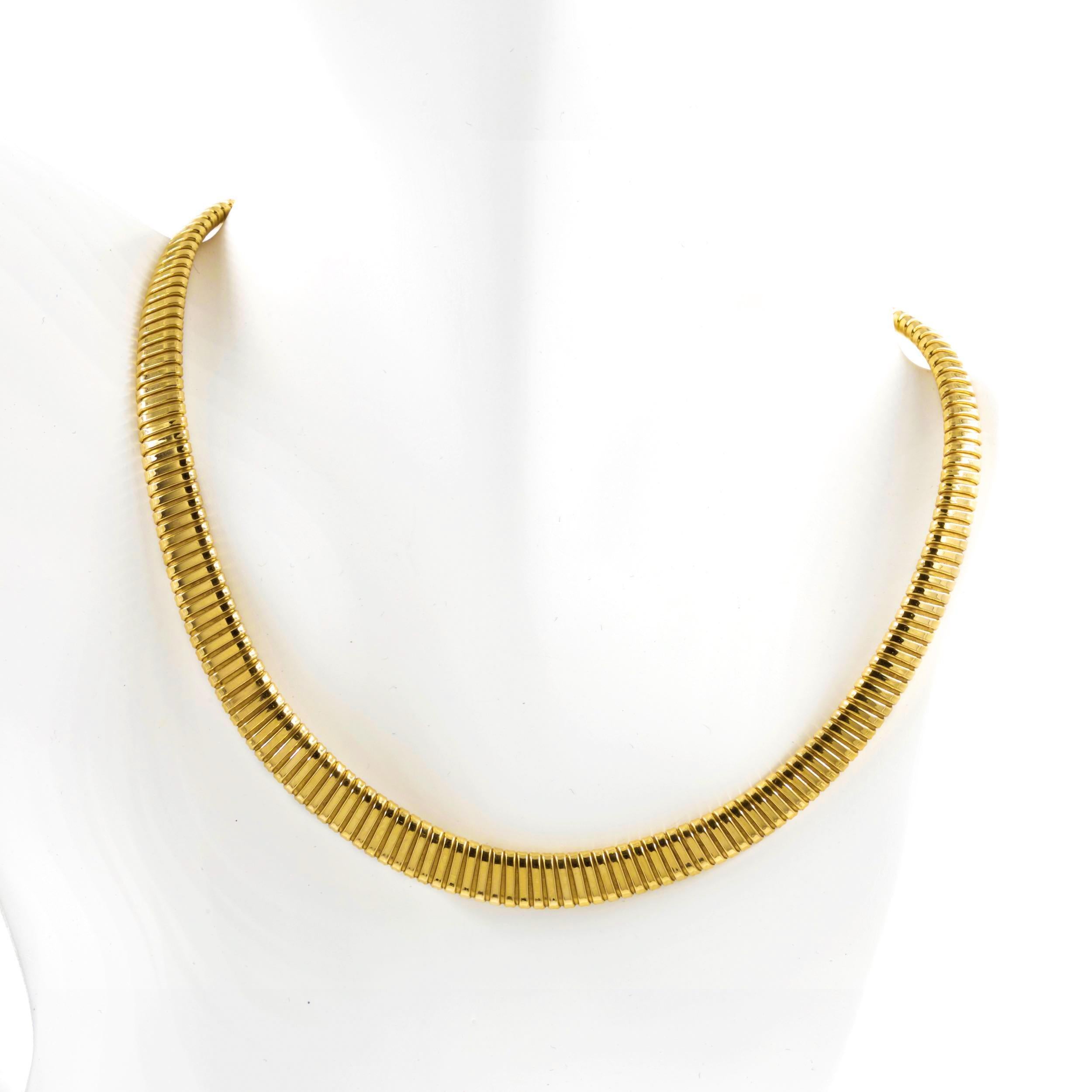 An absolutely gorgeous omega flexible-link choker necklace made by Campi Lino of Vincentino, Italy during the 1960s, this fine piece is crafted of 18k yellow gold with graduated links that shift and flex beautifully for comfort. It is secured with a