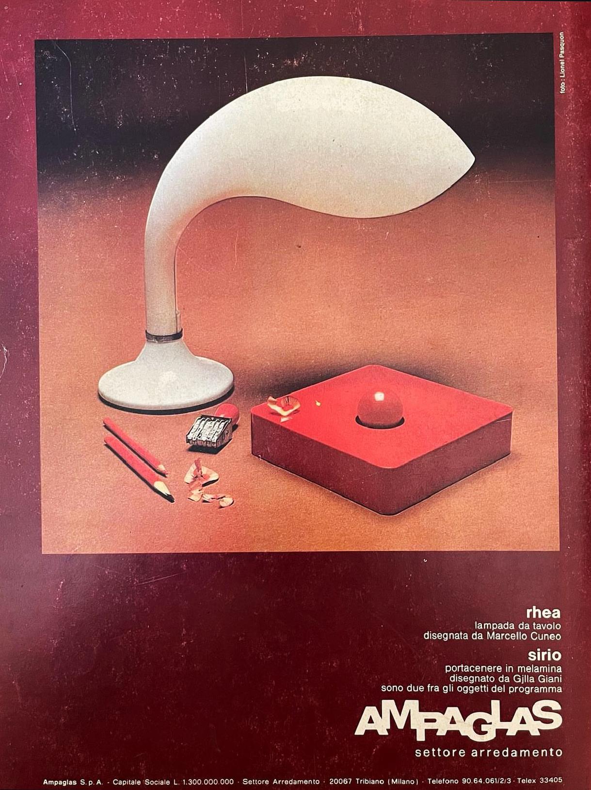 Vintage 1960s Italian Rhea Table Lamp by Marcello Cuneo for Ampaglas – As Seen on the Cover of Casa Vogue Italia (1971)

Own a piece of mid-century Italian design history with this stunning Rhea table lamp, designed by the renowned Marcello Cuneo in