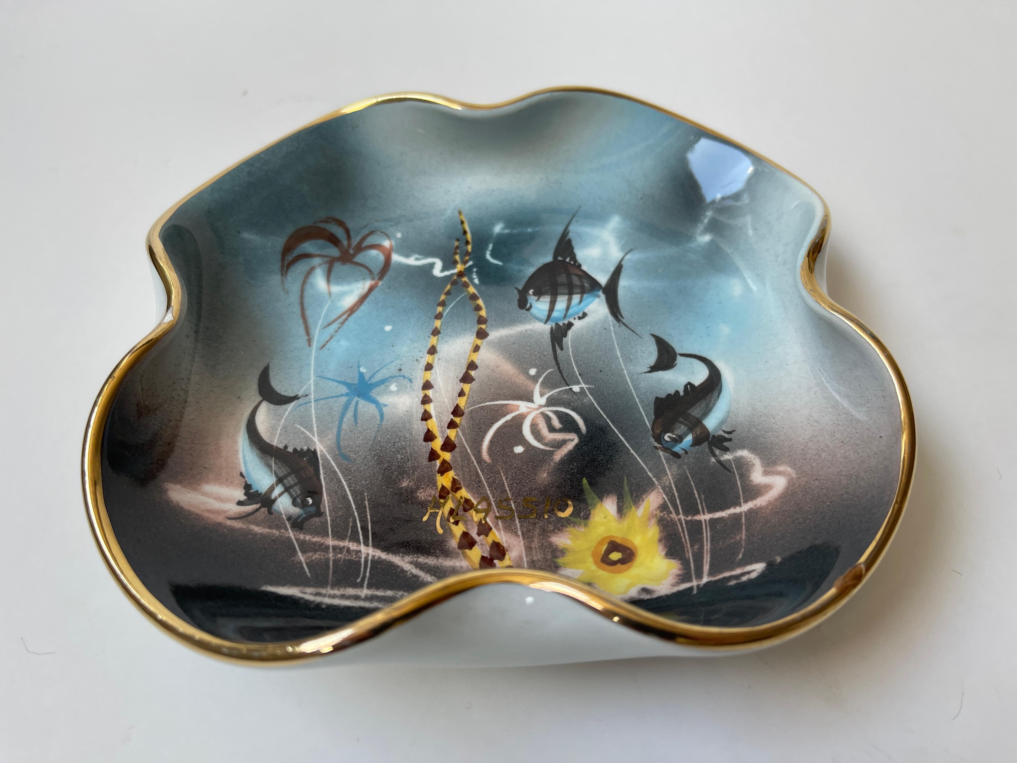 Amorphic 1960's ceramic vide-poche tray dish hand painted with aquatic scene from the Italian Riviera. Gilt rim surrounds the dish, signed ALASSIO.
Numbered on bottom  561 / 16.