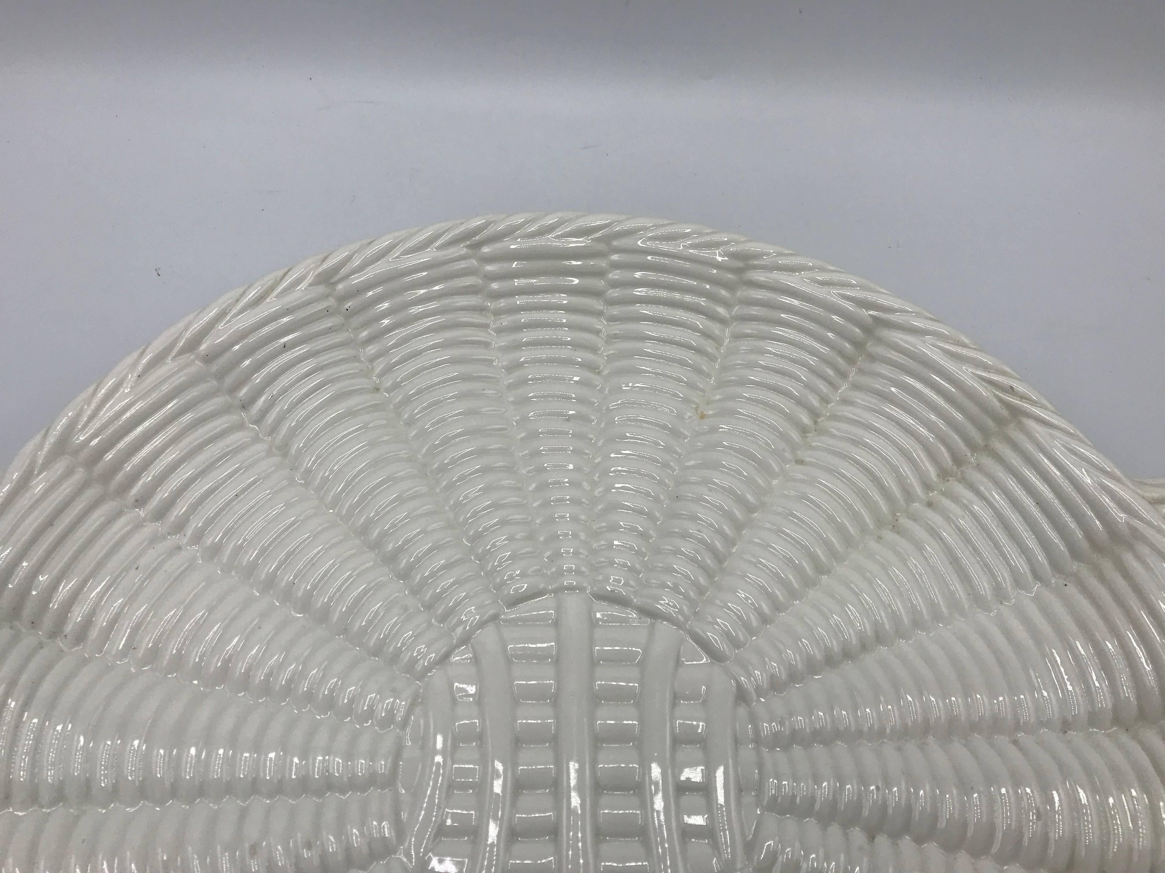 Listed is a stunning, 1960s Italian white ceramic, Saks Fifth Avenue basket weave serving tray charger. This piece is in excellent condition, with minor wear expected with age. Underside, marked 