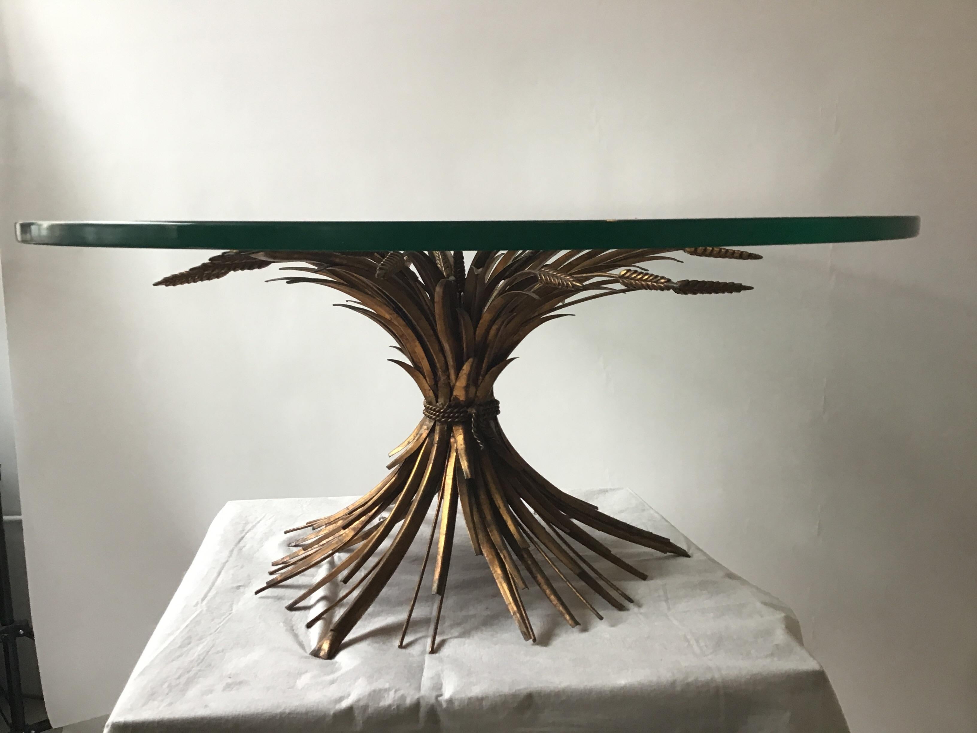 1960s Italian sheaf of wheat coffee table with thick glass top, from a Southampton estate.
Glass has 2 tiny chips on underside, and some scratches on top and side as shown in image 12.