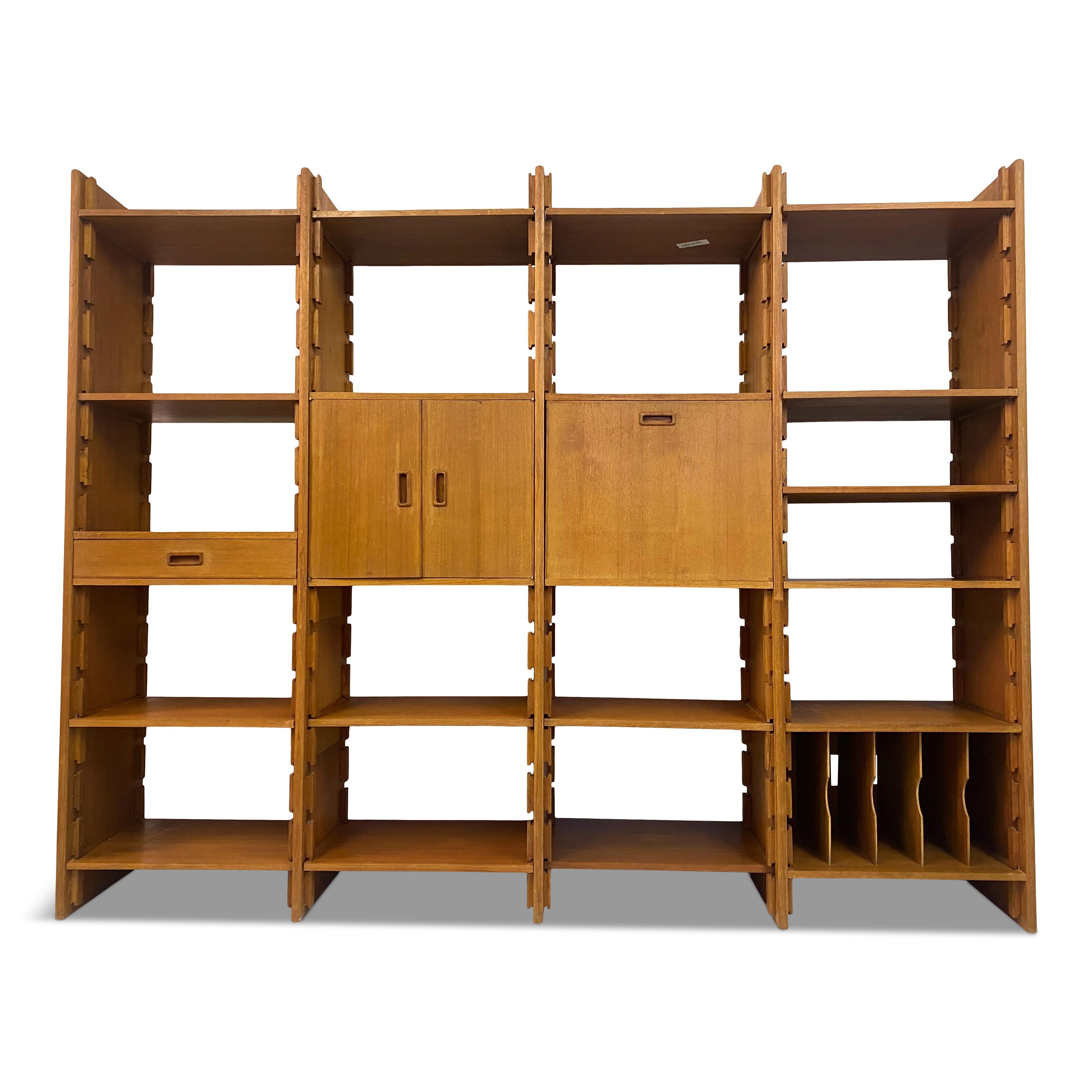 Wall unit or bookcase.

Teak

Consisting of five uprights and adjustable shelves.

Two cupboards

Italy, 1960s.
 