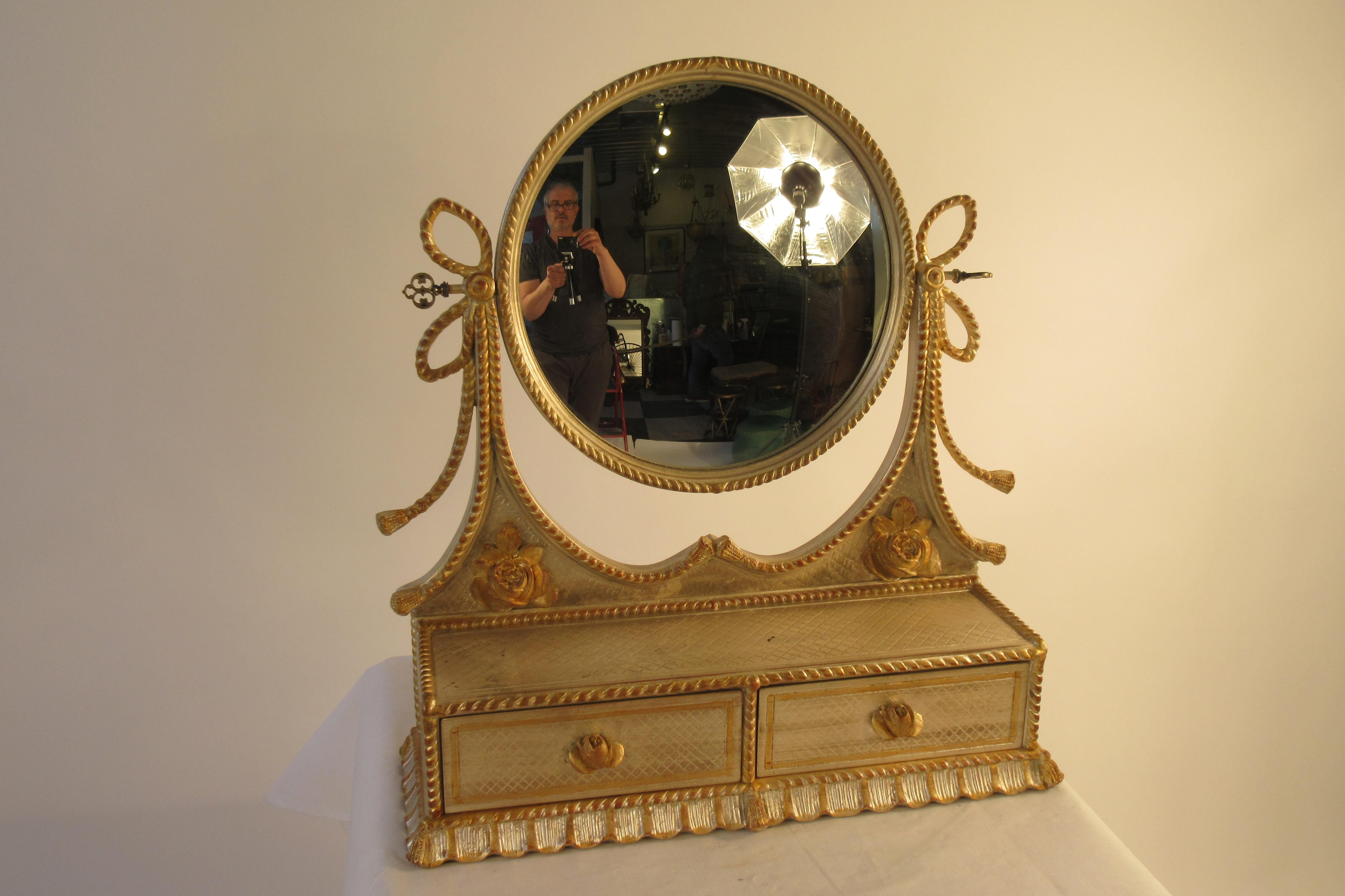 1960s Italian silver and gold painted vanity mirror. This item can be shipped UPS.