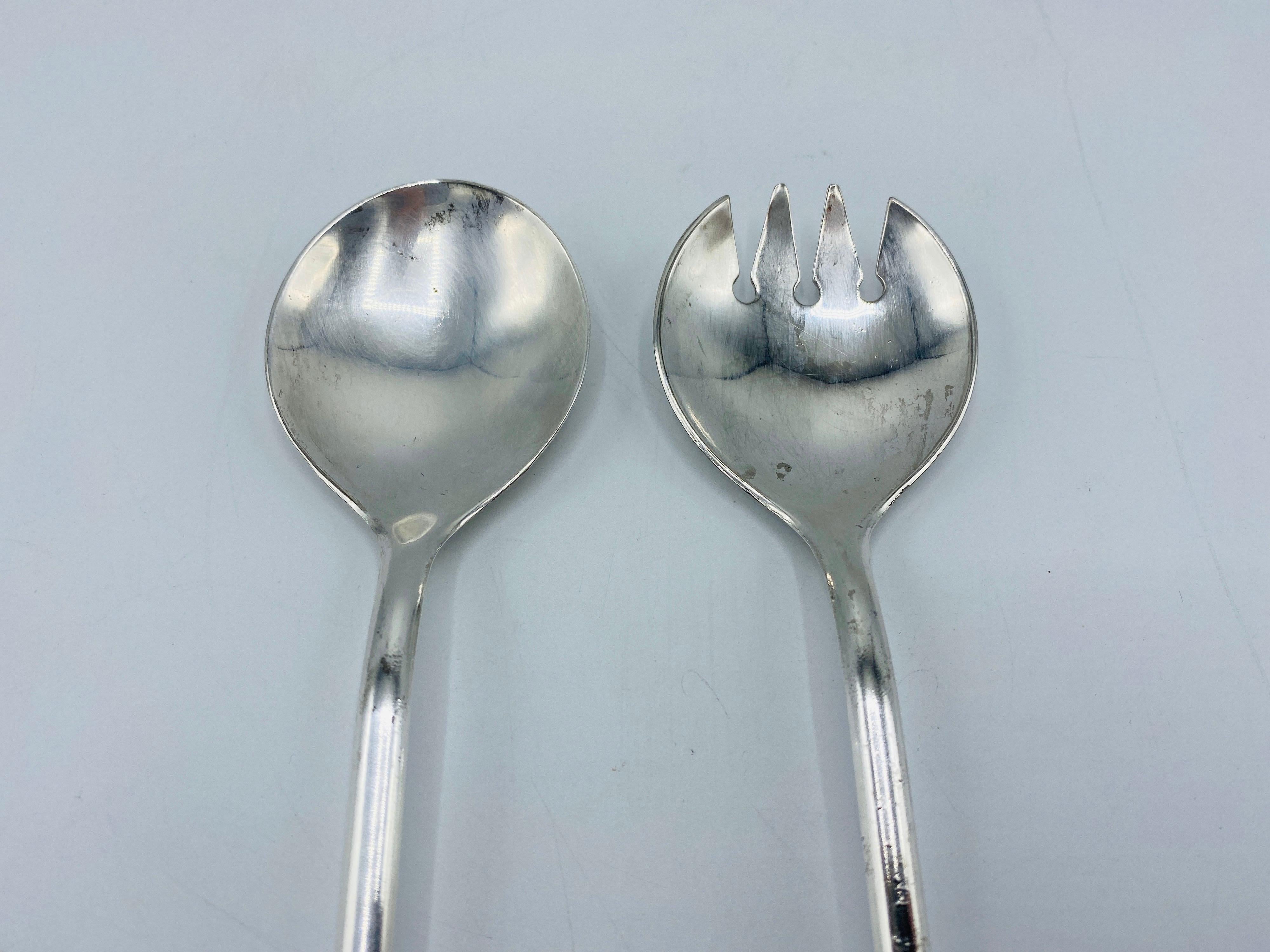 Offered is a beautiful, set of 1960s Italian silver-plate faux bamboo salad utensils. Set is one salad fork and one salad spoon. Marked 'Italy' and 'Silverplate' on backside of each.