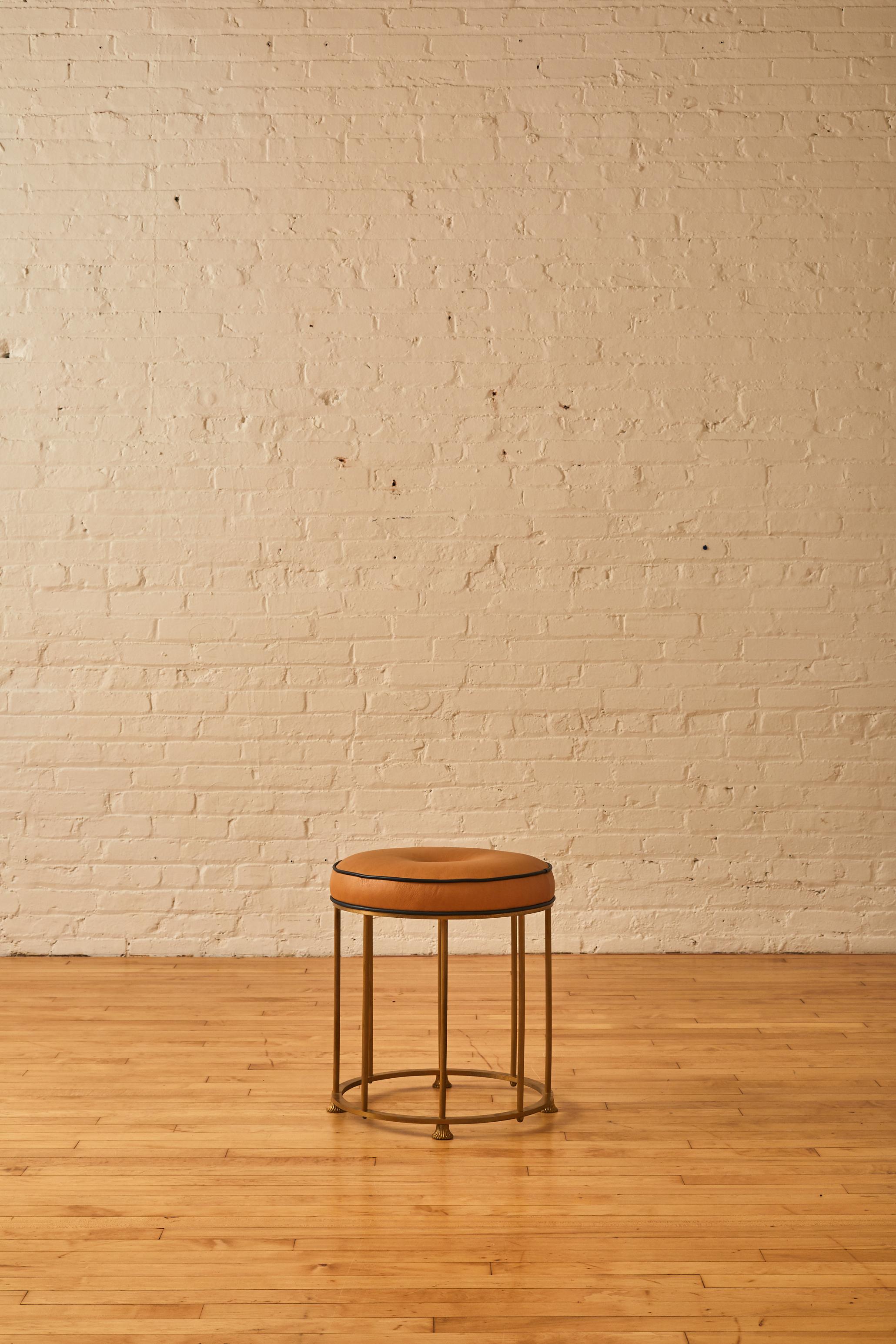 1960's Italian stool with a metal frame and leather tab button seat. 

