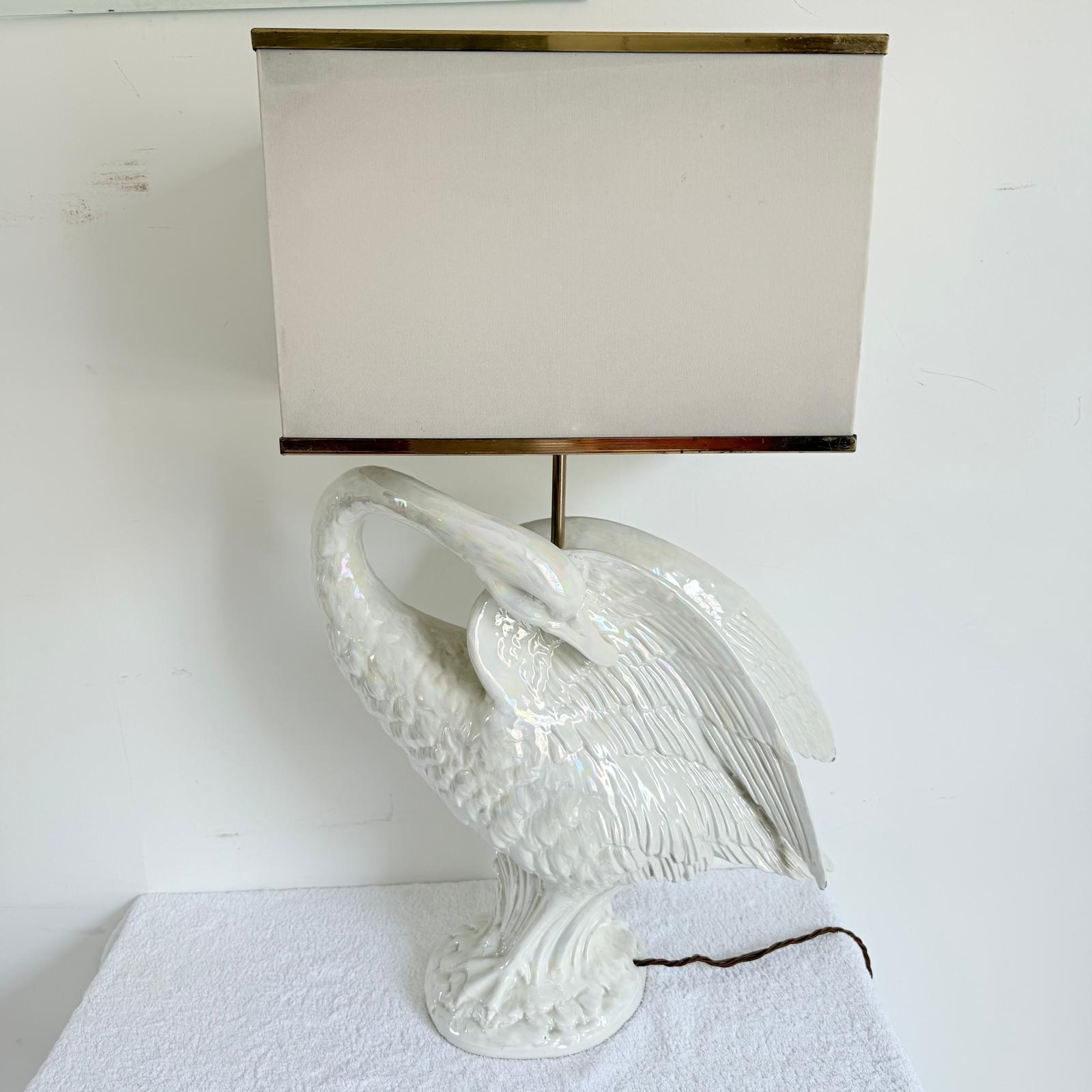 This superb vintage in form of the swan lamp in white glazed ceramic with rod in the centre to support a shade. Made in Italy c.1960's. measurements of the lamp not included shade, and shade is not included. Wired to UK standards 