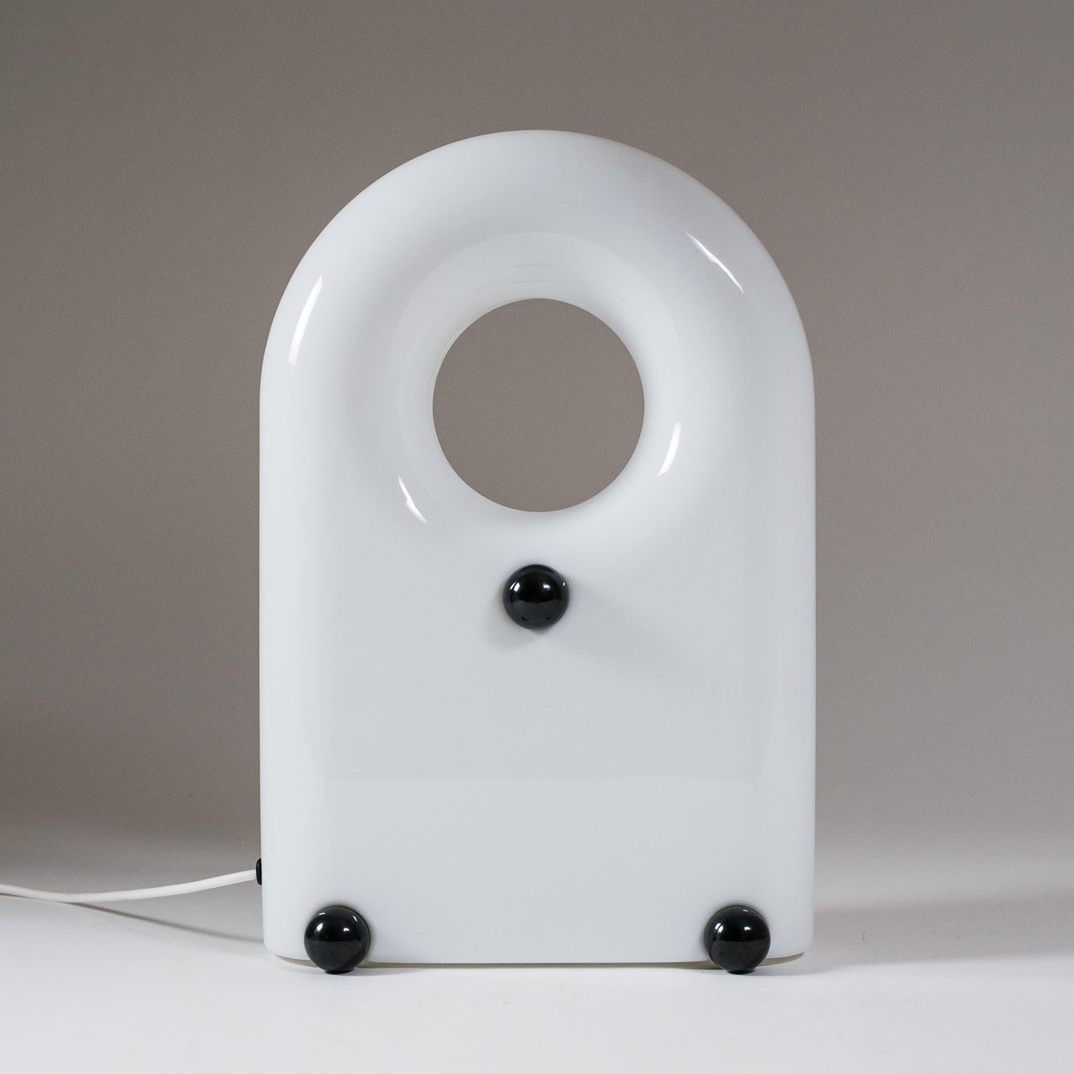 Sculptural Italian lamp from the 1960s. Made of white acrylic this can be used as a table lamp as well as a floor lamp. Its stylized 'bag'-shape with large handle invites for it to be moved around to where a very soft ambient light is required.