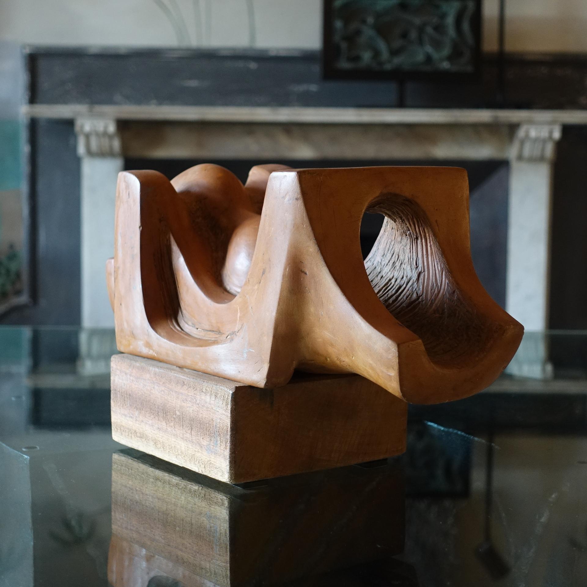 Abstract terracotta sculpture on wood base, perfect condition and vintage patina, signed T.Assi, Italy, circa 1960s.