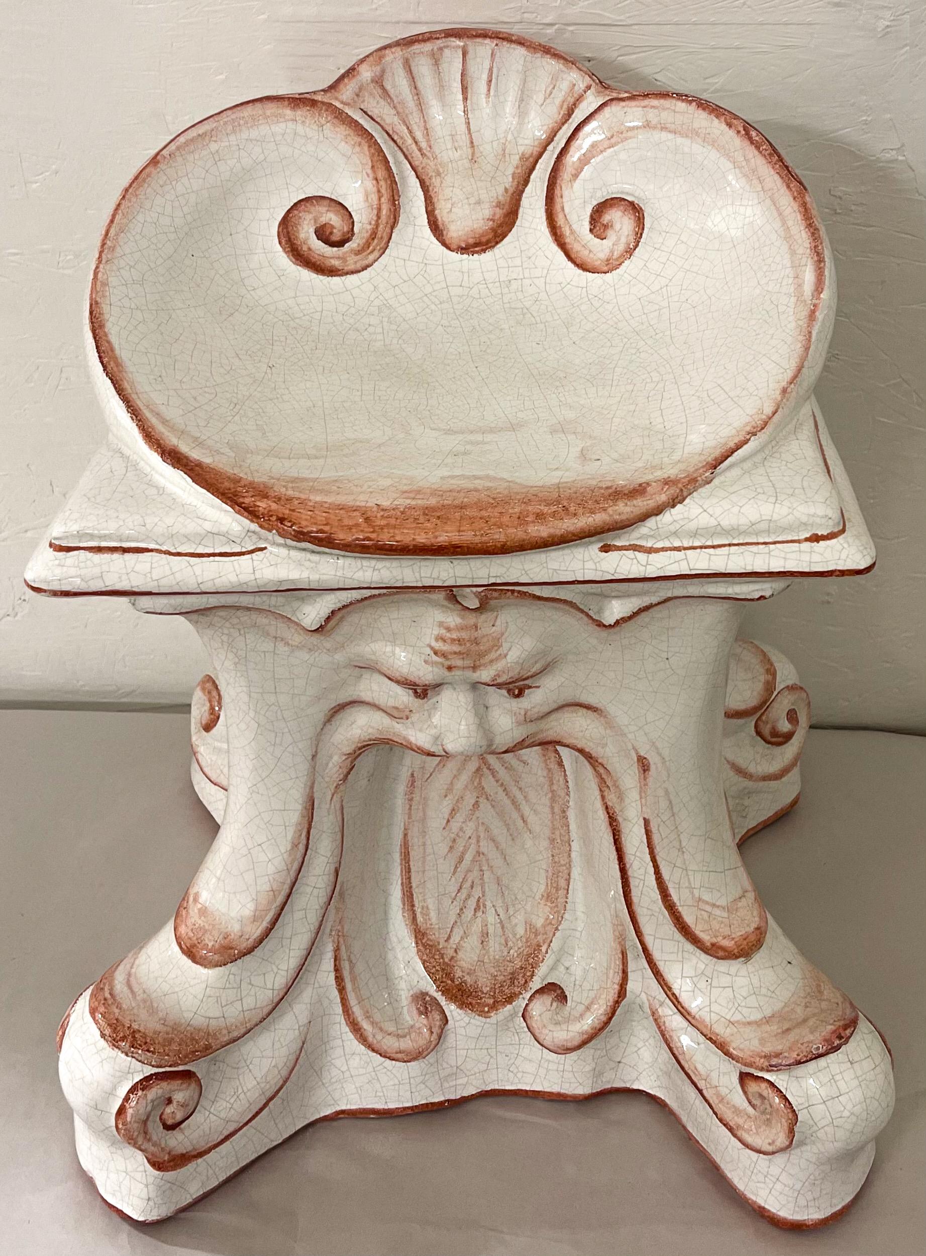 This is a wonderful Italian garden seat. It is terracotta with a North Wind and shell motif. Note the chair form as opposed to the traditional stool or barrel style. Lovely color and detail.