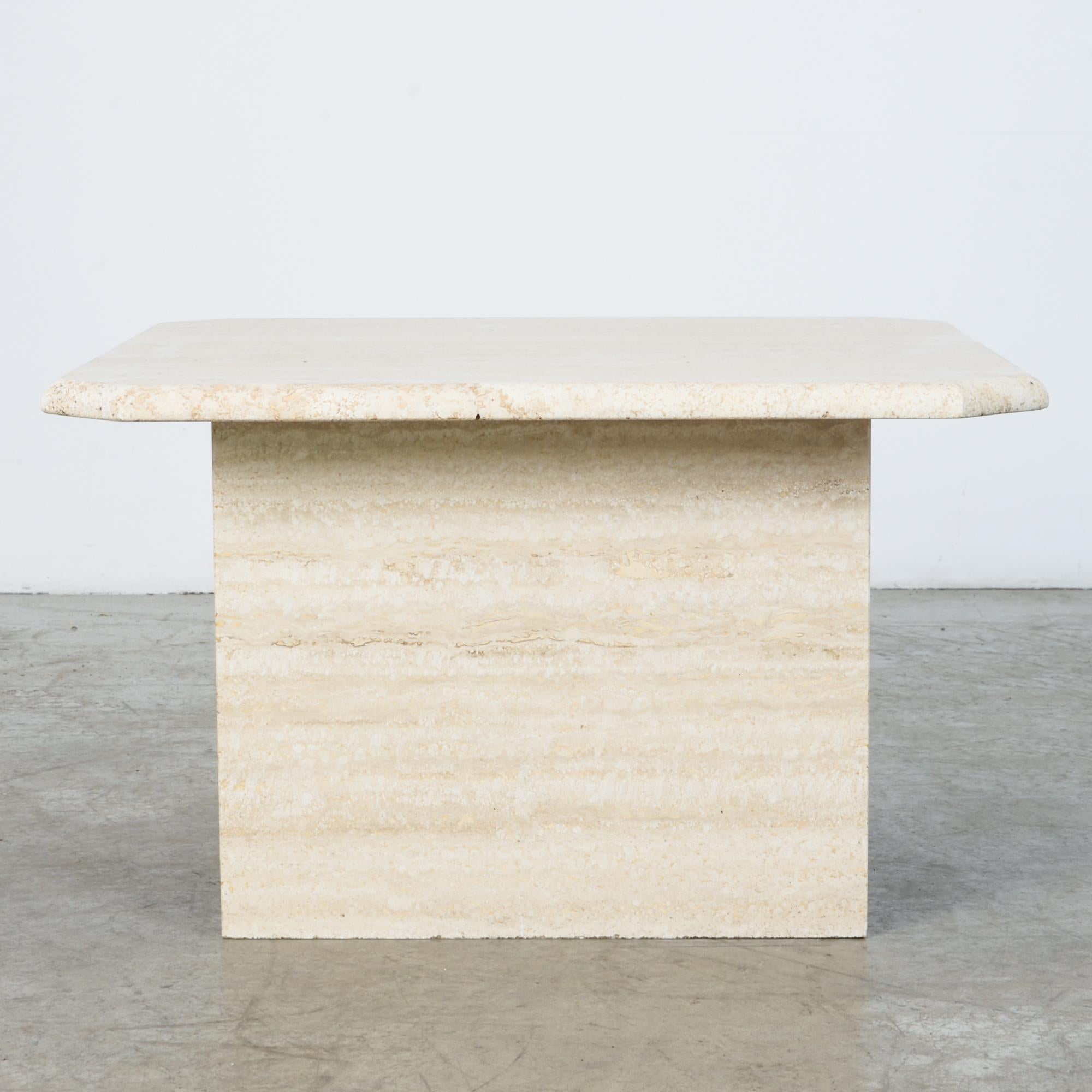 A square top resting on simple legs and lower shelf makes a great accent in stone. A material rich in itself, echoing classical sculpture. A design that's sleek and at the same time sumptuous. Associations from antiquity to 1970s kitsch, this is a