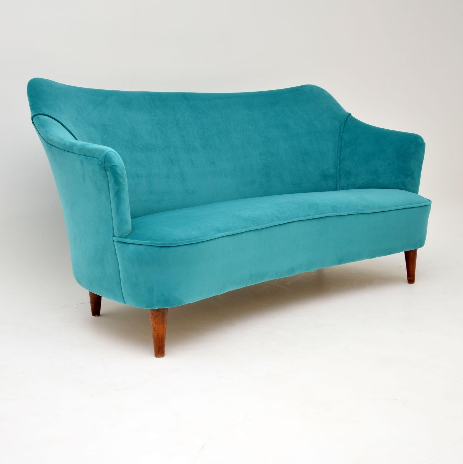 A stunning vintage cocktail sofa, this was made in Italy and dates from the 1960s. This is quite small and might have been intended as a child’s sofa. It can seat two adults, but as a perched love seat rather than a lounger. It is very well made and