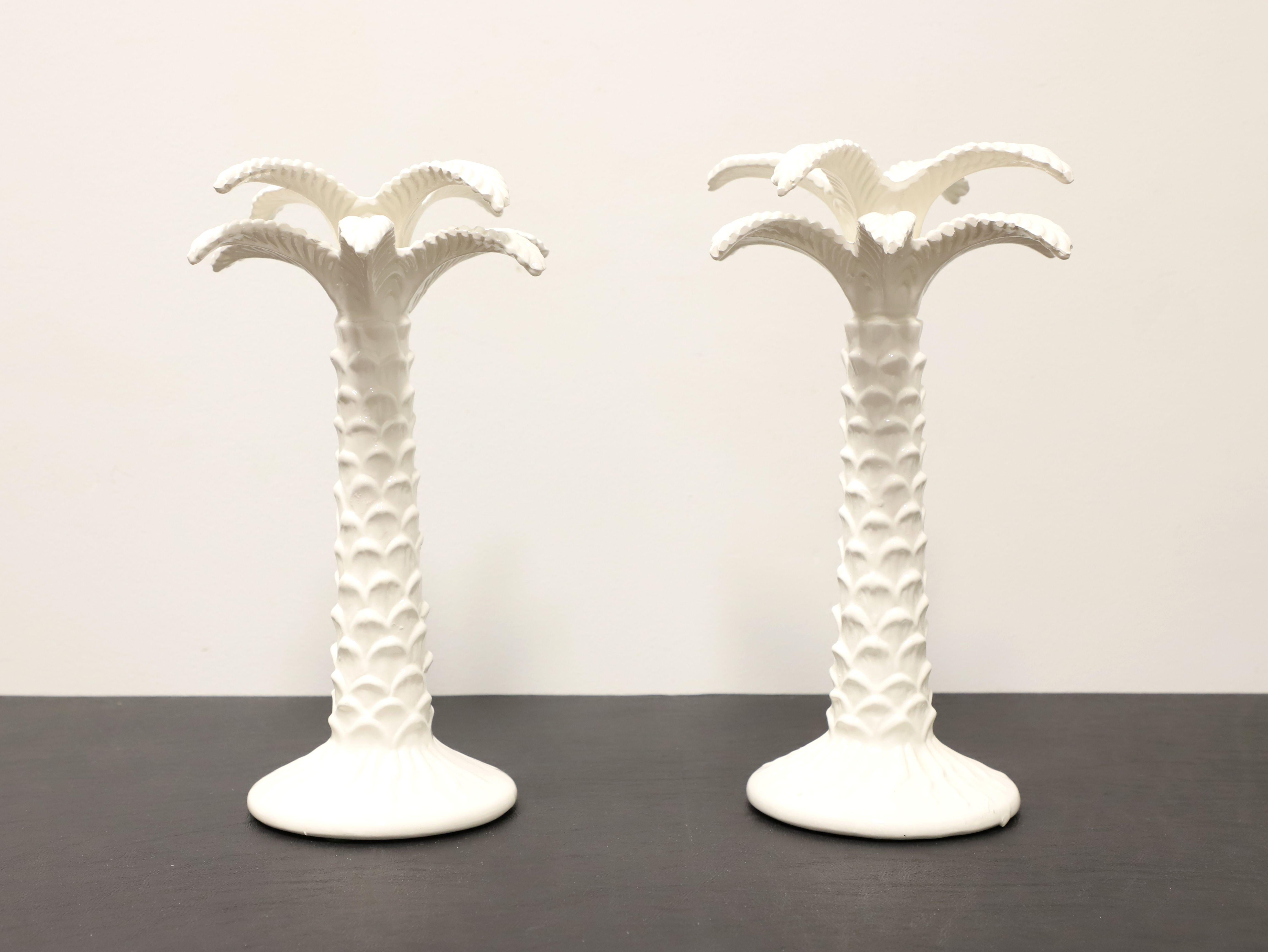 A pair of Italian candlesticks in the shape of palm trees, unbranded. Tall, white color porcelain and glazed. Unsigned, artist unknown. Made in Italy, in the Mid 20th Century. 

Measures:  7.5w 7.5d 12.25h, Weighs: 2 lbs Each

Excellent vintage