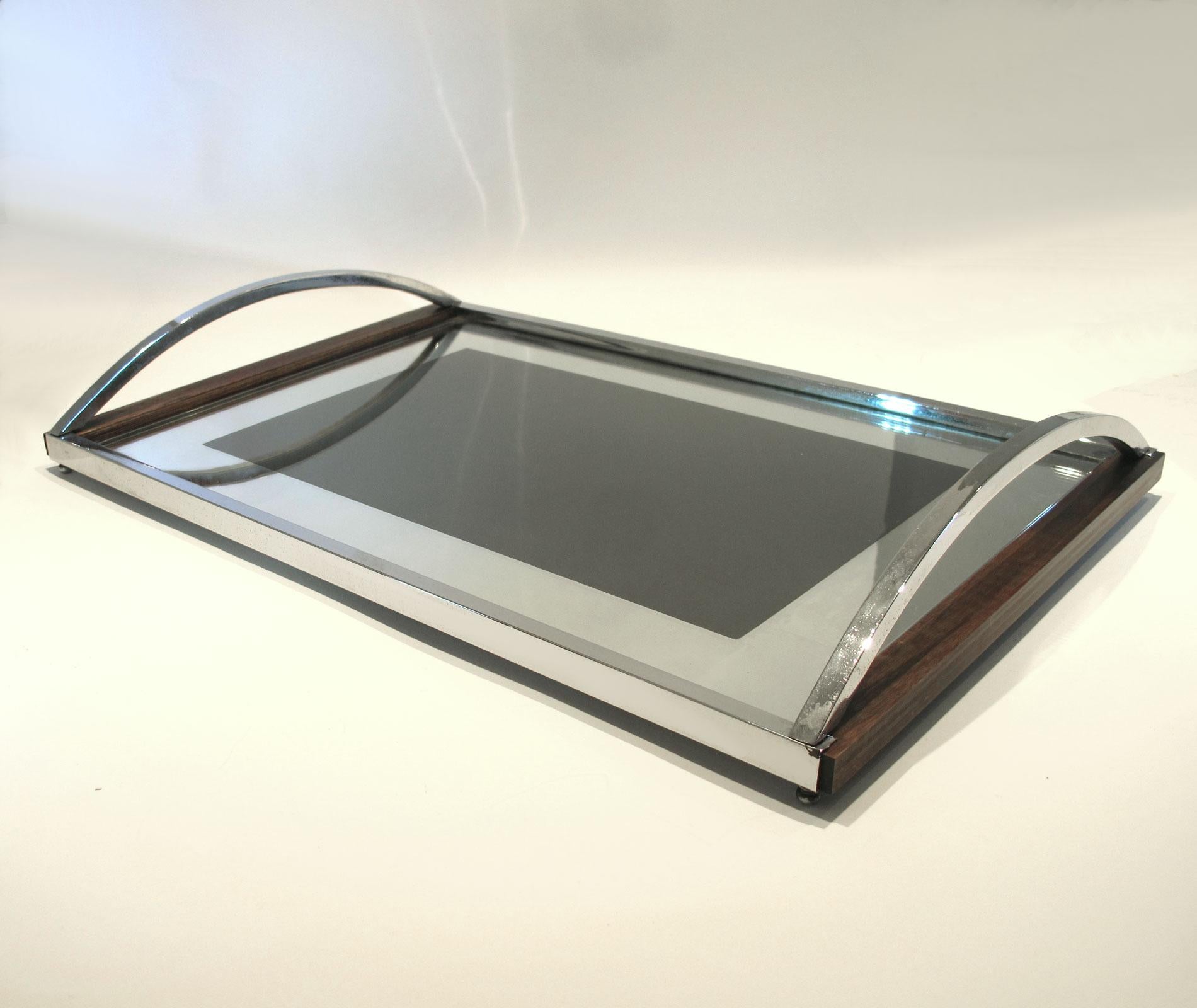 Large rectangular tray with simple curved chrome handles, wood and chrome frame and mirrored framed glass base.

   