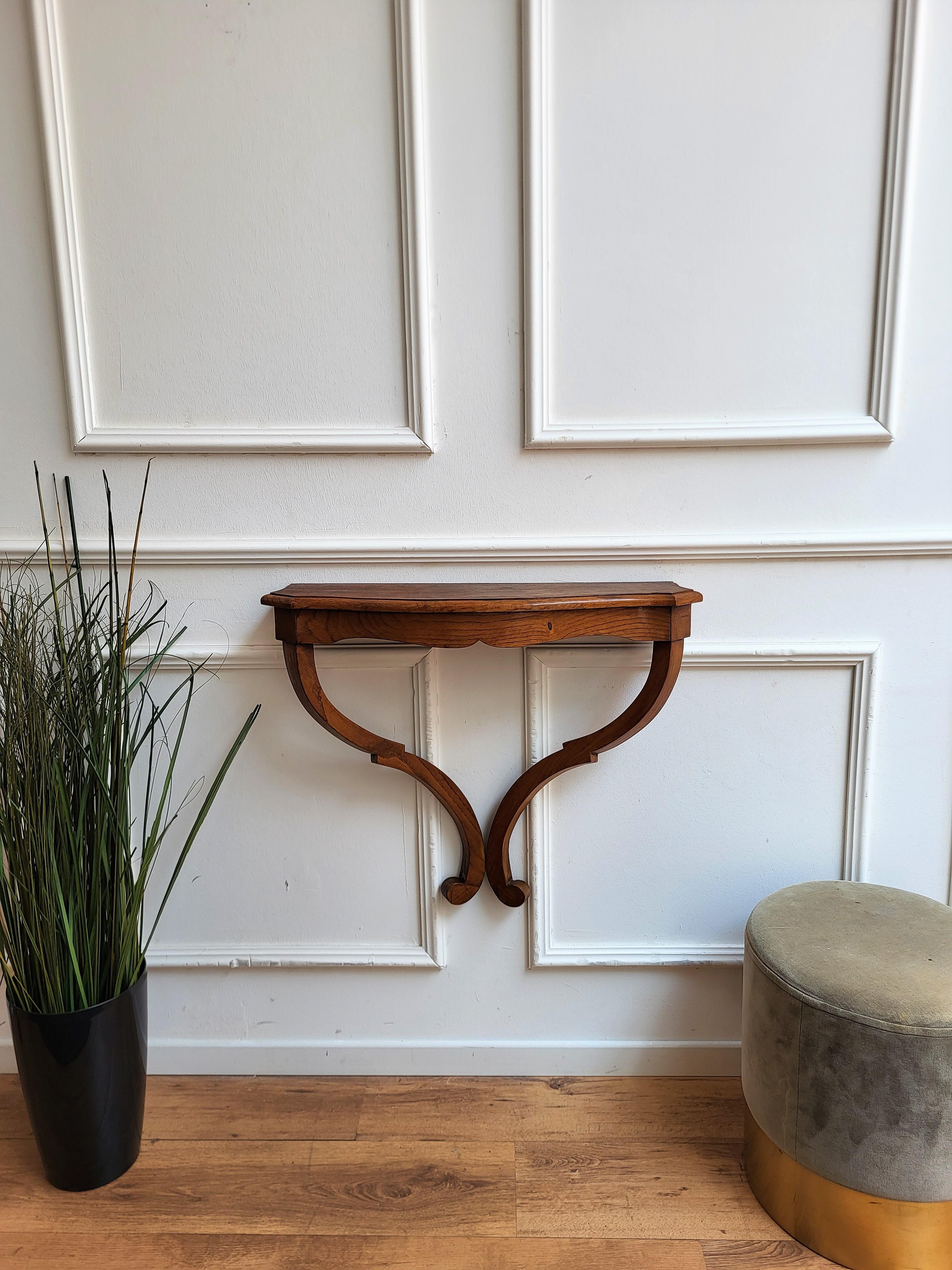 Beautiful 1960s Italian Mid-Century Modern wall console table or shelf, perfect in any entrance, hallway as well as in any other room as extra holding shelf. The console table is entirely made of very beautiful and durable solid wood with a beveled